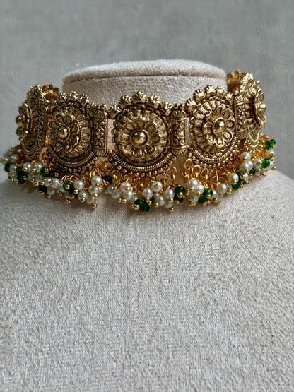 Ayura Designs Nooriya Choker Set with Jhumkis & Tikka: Exquisite Gold-Tone Ensemble Adorned with White & Green Beads