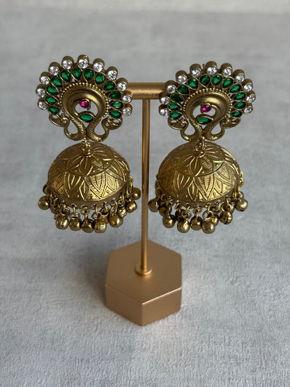 Ayura Designs Moraya Jhumkis – Emerald Green Peacock Motif with Antique Gold Detailing