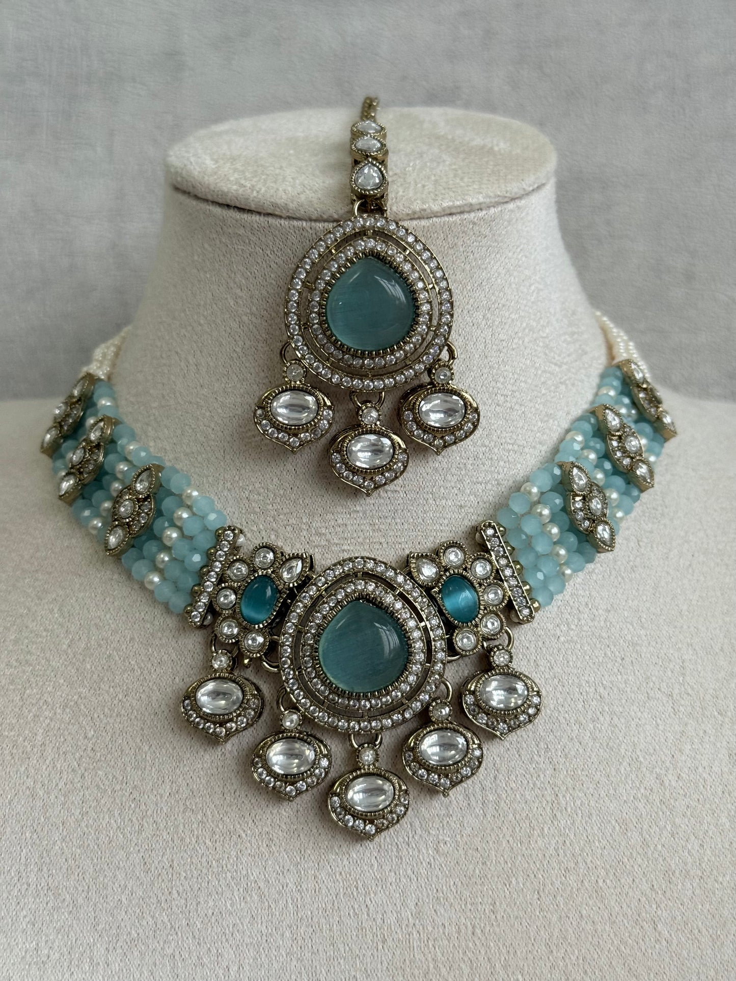 Ayura Designs Rahi Necklace Set with Earrings & Tikka – Aqua Blue Stones with Mirror-Cut Detailing & Pearl Strands