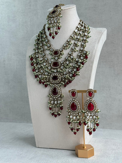 Ayura Designs Sahra Bridal Set with Earrings & Tikka – Ruby Red, Kundan Stones, Pearls & Emerald Green Accents in Antique Gold Finish