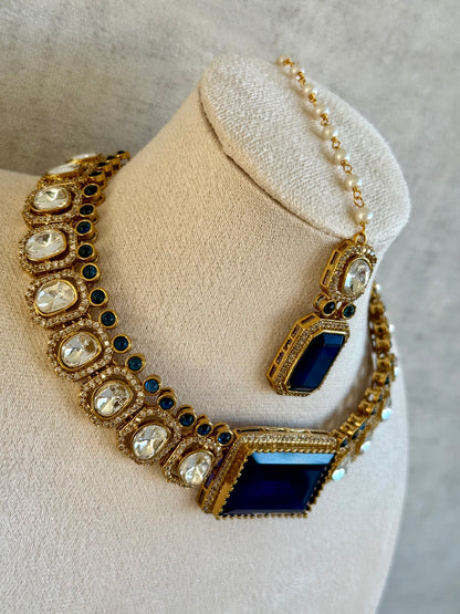 Ayura Designs Clara Set with Earrings & Tikka  – Royal Blue Stones with Moissanite and Antique Gold Finish