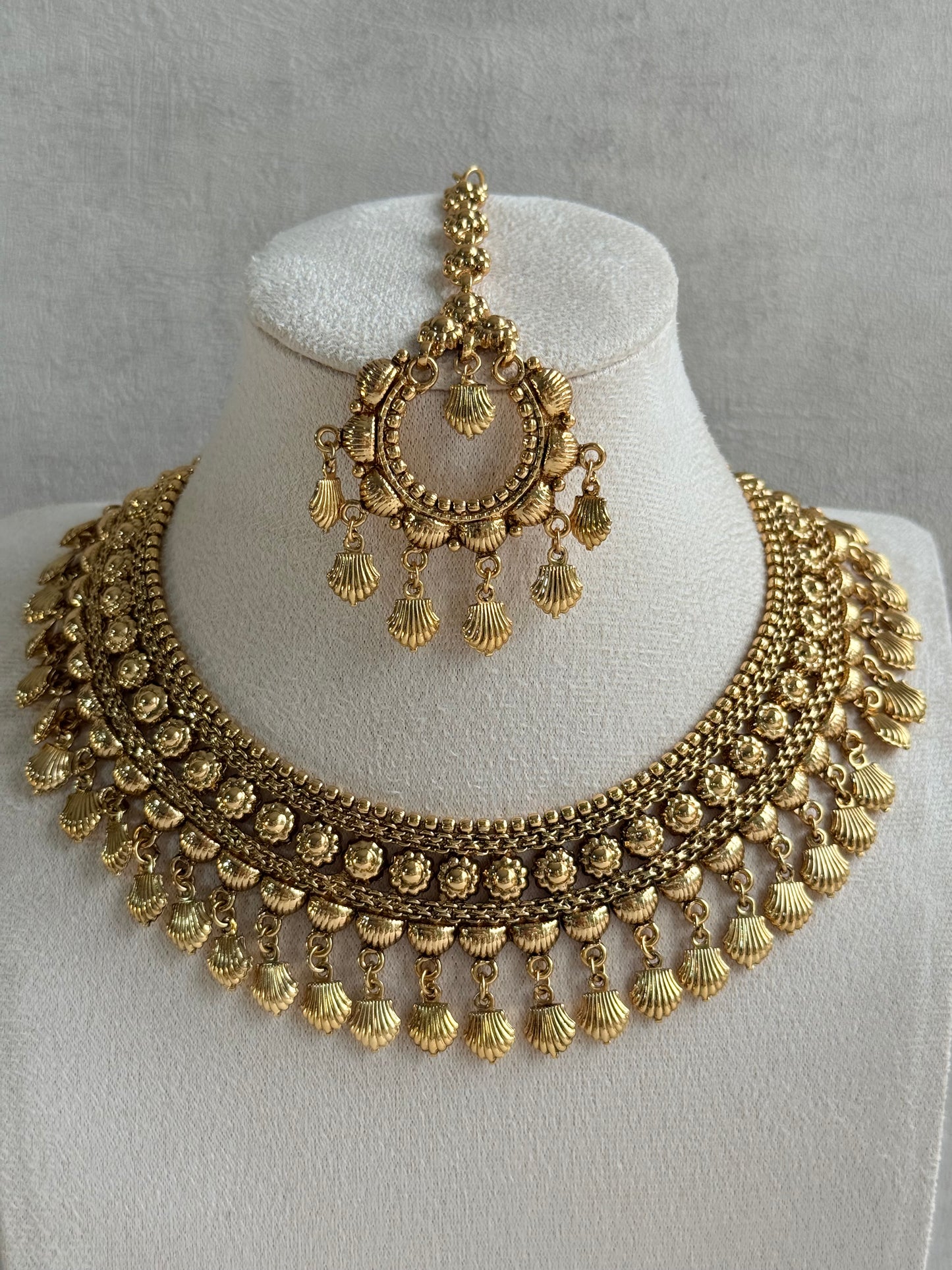 Ayura Designs Falaq Necklace Set with Earrings & Tikka – Gold Finish with Layered Chain, Floral & Shell Drop Detailing