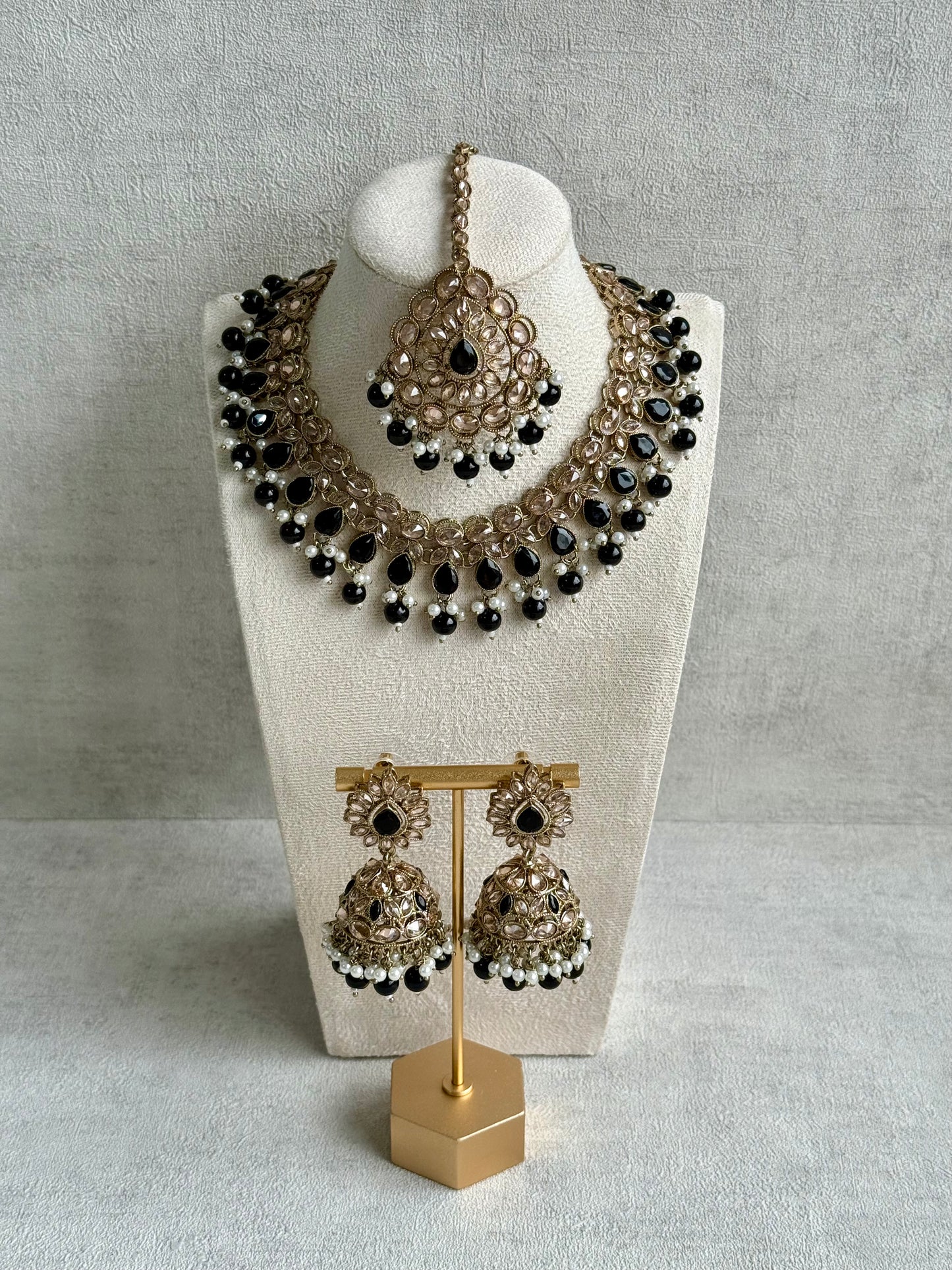 Ayura Designs Emaan Set with Jhumkis & Tikka – Black Beads, Mirror-Cut Stones & Antique Gold Finish