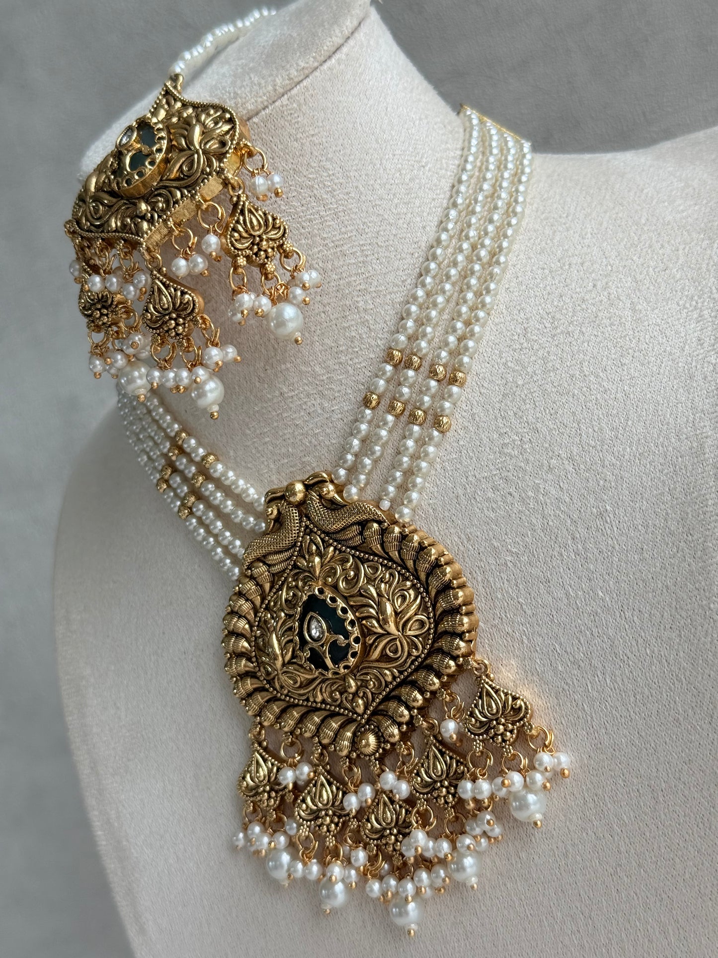 Ayura Designs Afia Necklace Set with Earrings & Tikka – Antique Gold, Ivory Pearls, Green Centre Stone & Peacock Motifs