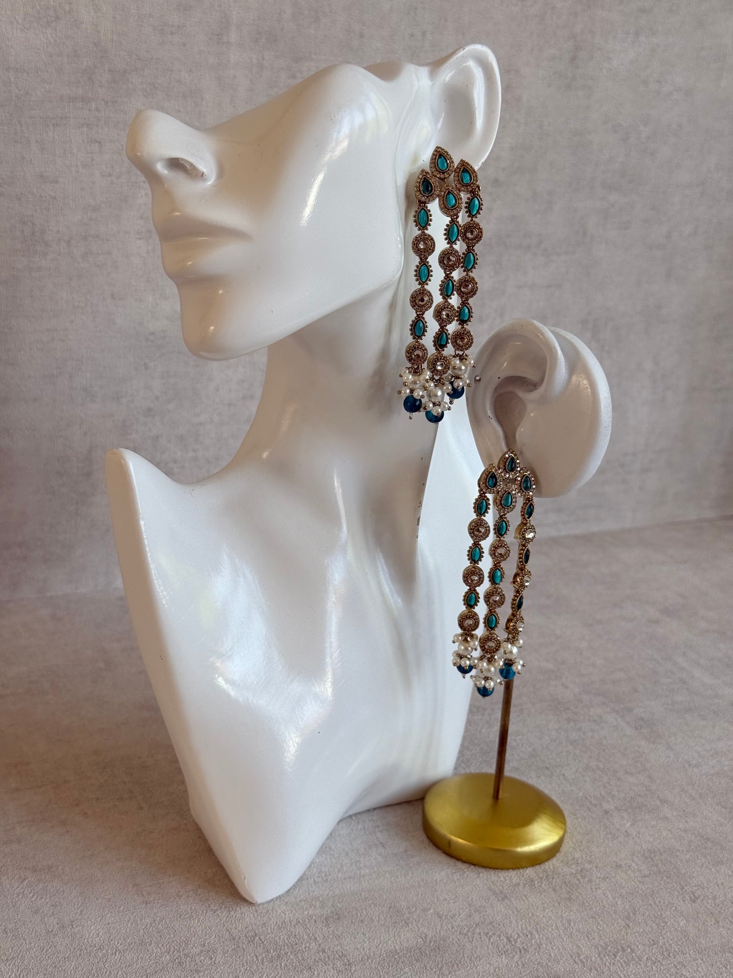 Ayura Designs Emilia Earrings – Gold Triple Strand Statement Earrings with Peacock Blue Stones & Pearl Drops