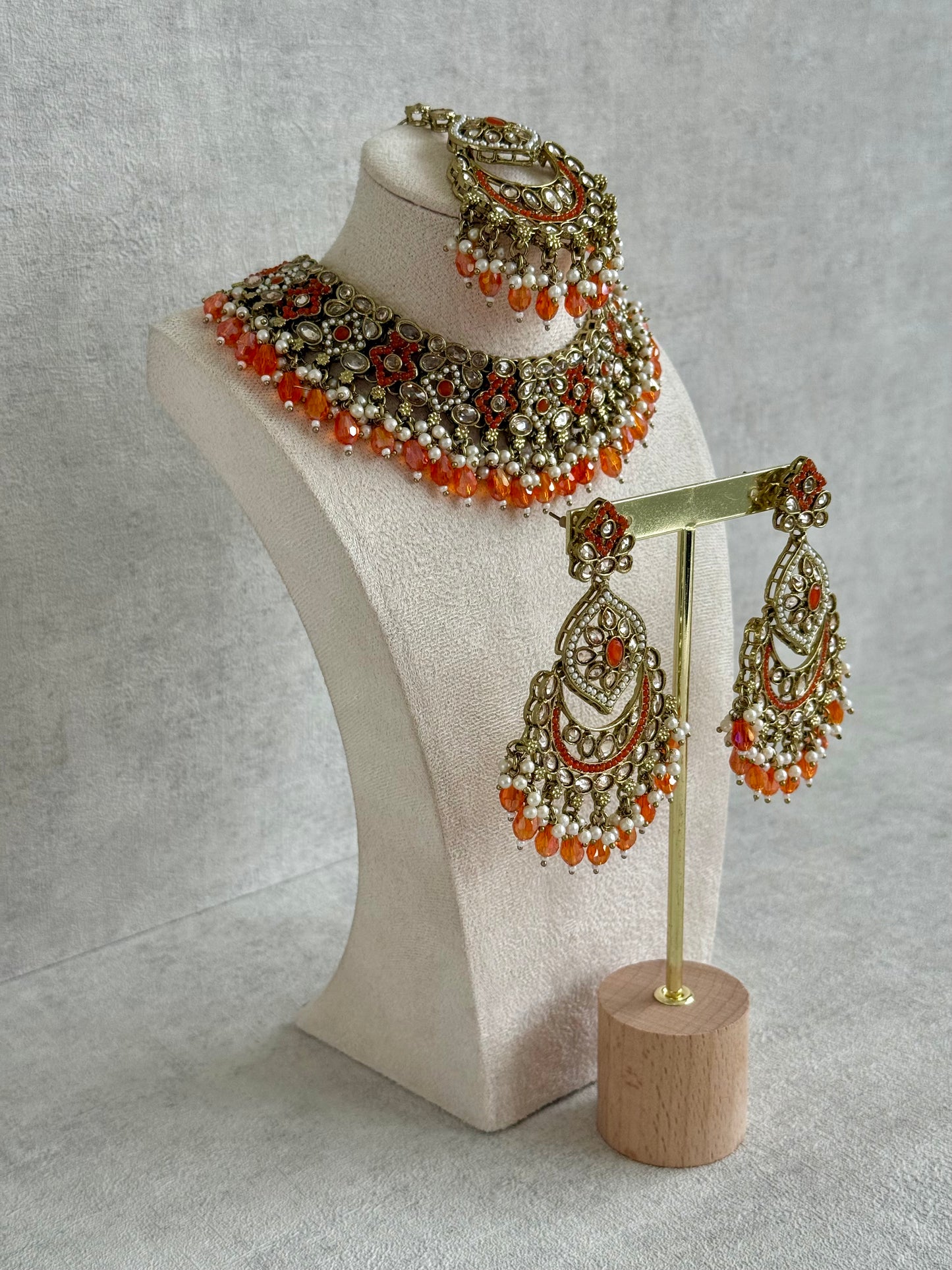 Ayura Designs Jazba Set with Necklace, Jhumkis & Tikka – Antique Gold, Mirror-Cut Stones, Pearl Detailing & Fiery Orange Beads