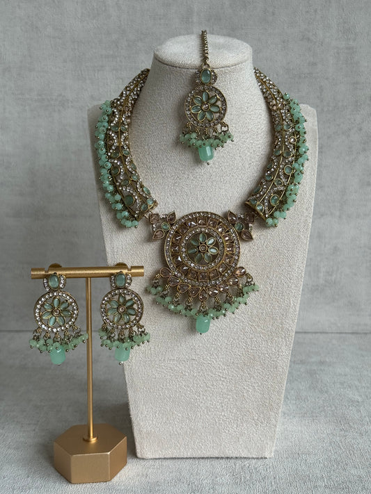 Ayura Designs Niya Set with Necklace, Earrings & Tikka – Pistachio Green Beads, Antique Gold & Floral Design