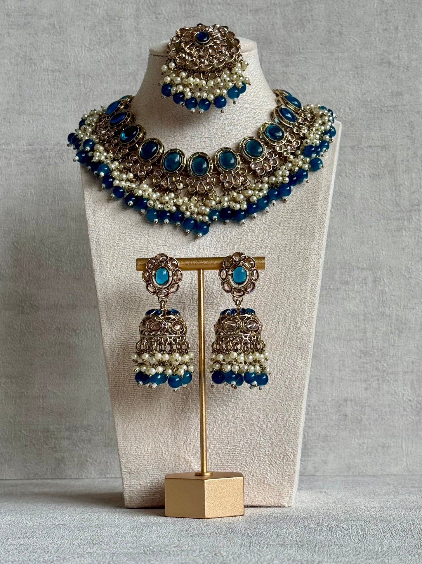 Ayura Designs Zubi Set with Jhumkis & Tikka – Deep Blue Stones, Pearl Detailing & Antique Gold Finish