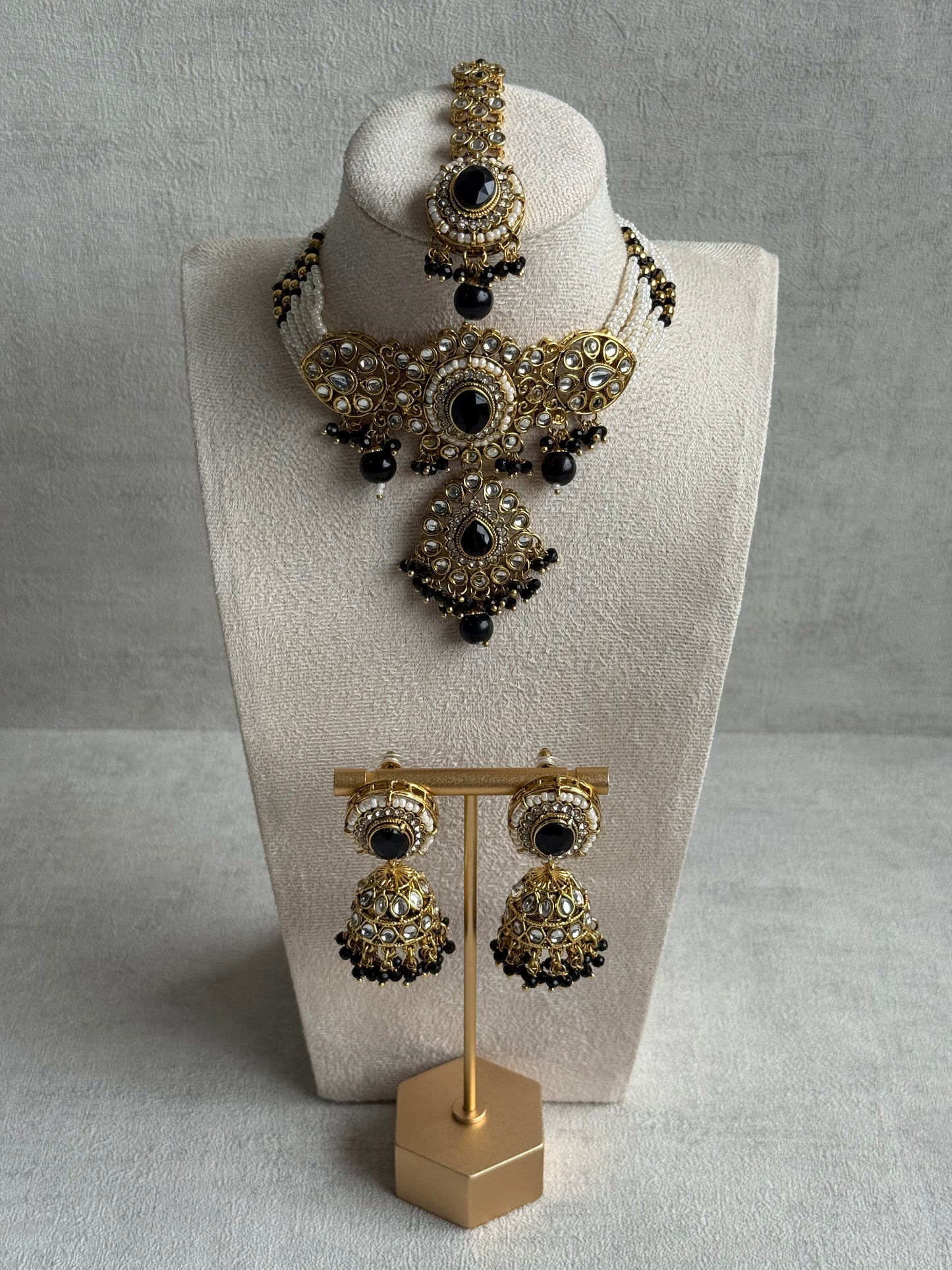Ayura Designs Muskaan Set – Choker, Jhumkis & Tikka with Black Beads, Kundan Stones & Antique Gold Finish