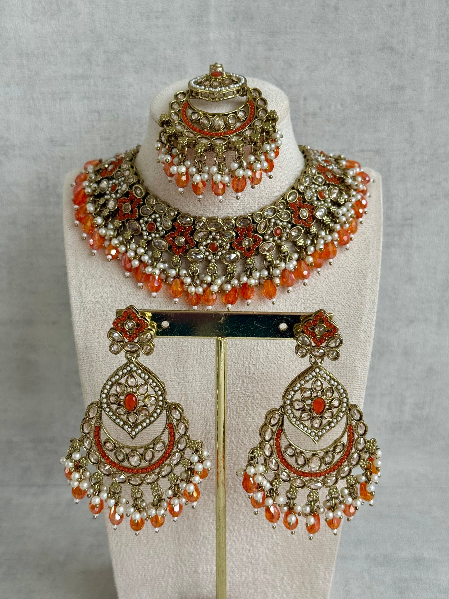 Ayura Designs Jazba Set with Necklace, Jhumkis & Tikka – Antique Gold, Mirror-Cut Stones, Pearl Detailing & Fiery Orange Beads