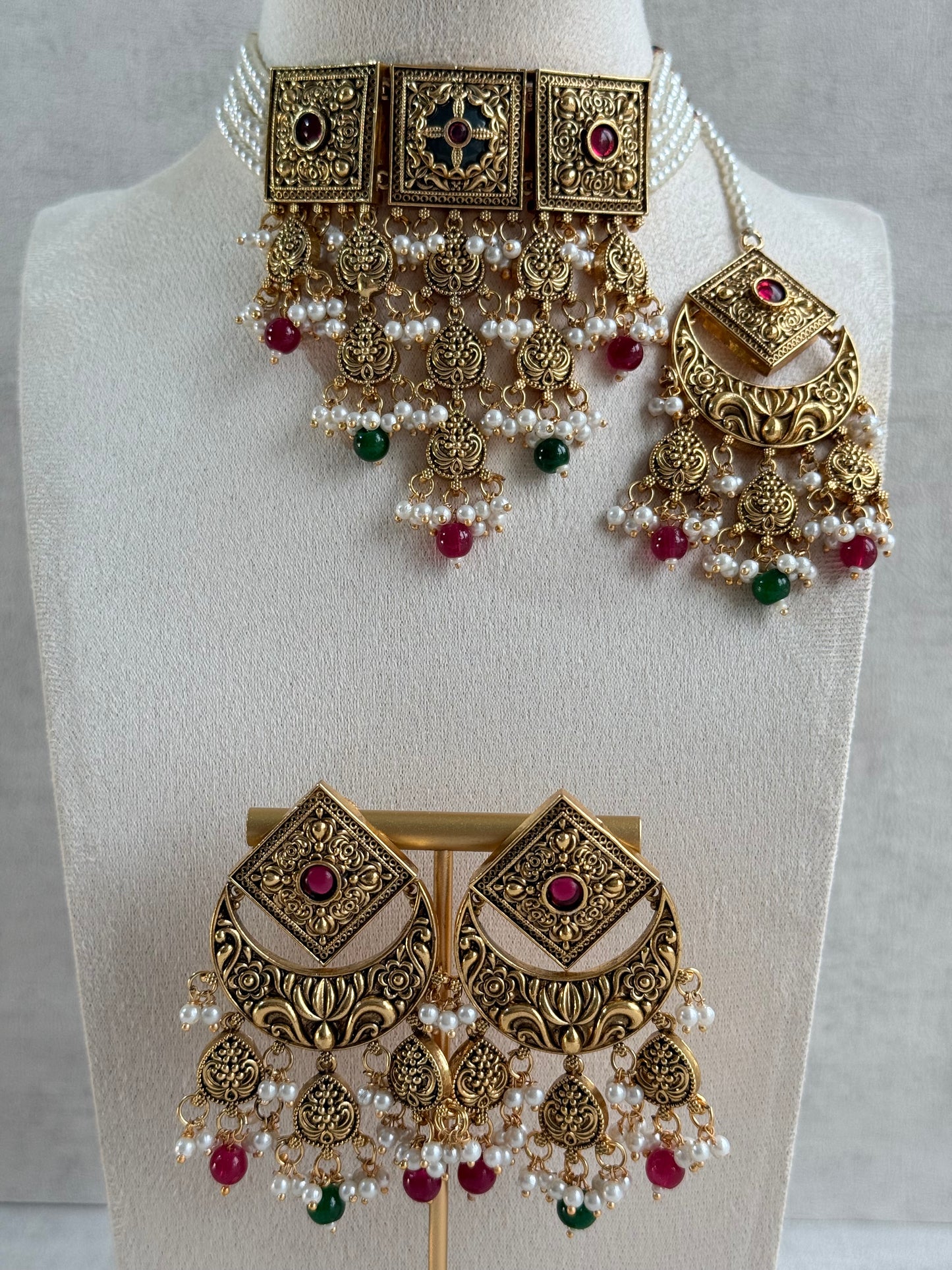 Ayura Designs Samera Choker Set with Earrings & Tikka – Rani Pink & Emerald Green Beads, Pearl Detailing, Green Centre Stone, Floral Motifs & Antique Gold Finish