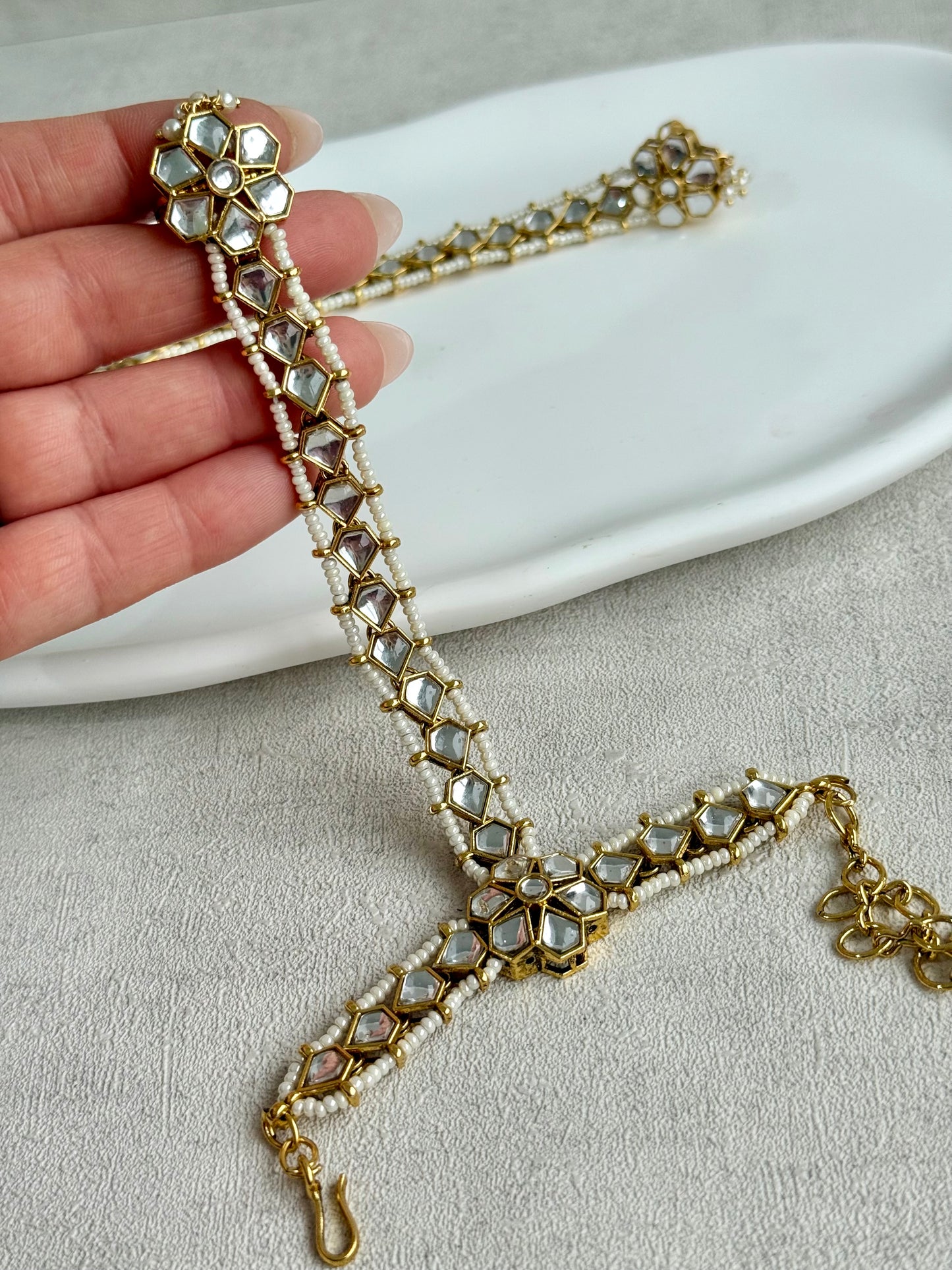 Ayura Designs Yara Haathphool – Mirror-Cut Stones with Pearl Bead Detailing in Antique Gold Finish