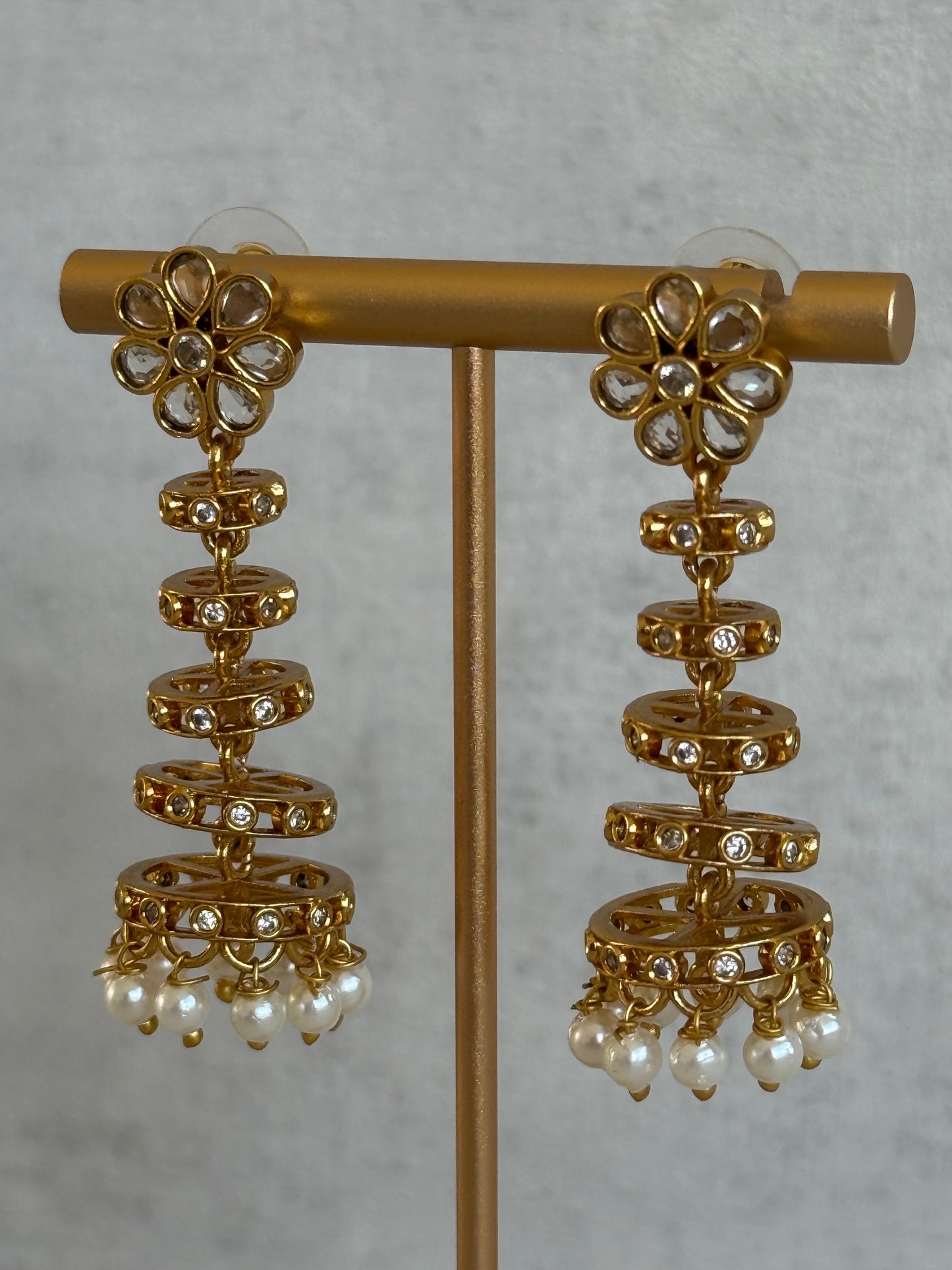 Ayura Designs Adira Jhumkis – Gold Floral Jhumkis with Layered Crystal Rings & Pearl Drops