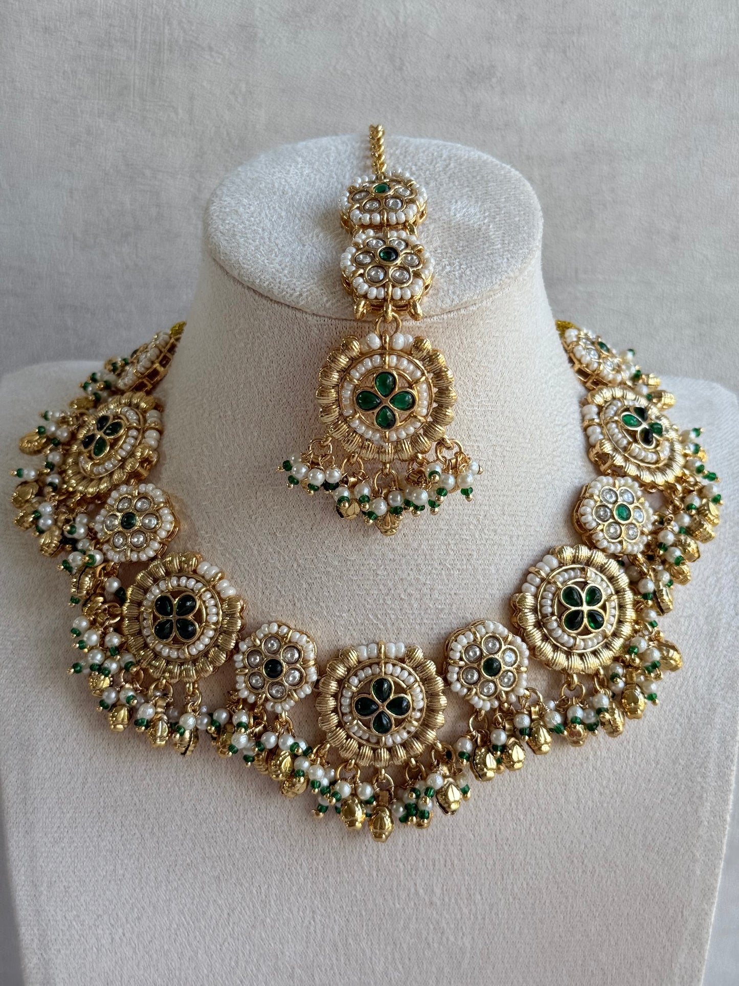 Ayura Designs Manika Necklace Set with Earrings & Tikka – Gold Finish with Emerald Green Stones, Pearls & Ghungroos