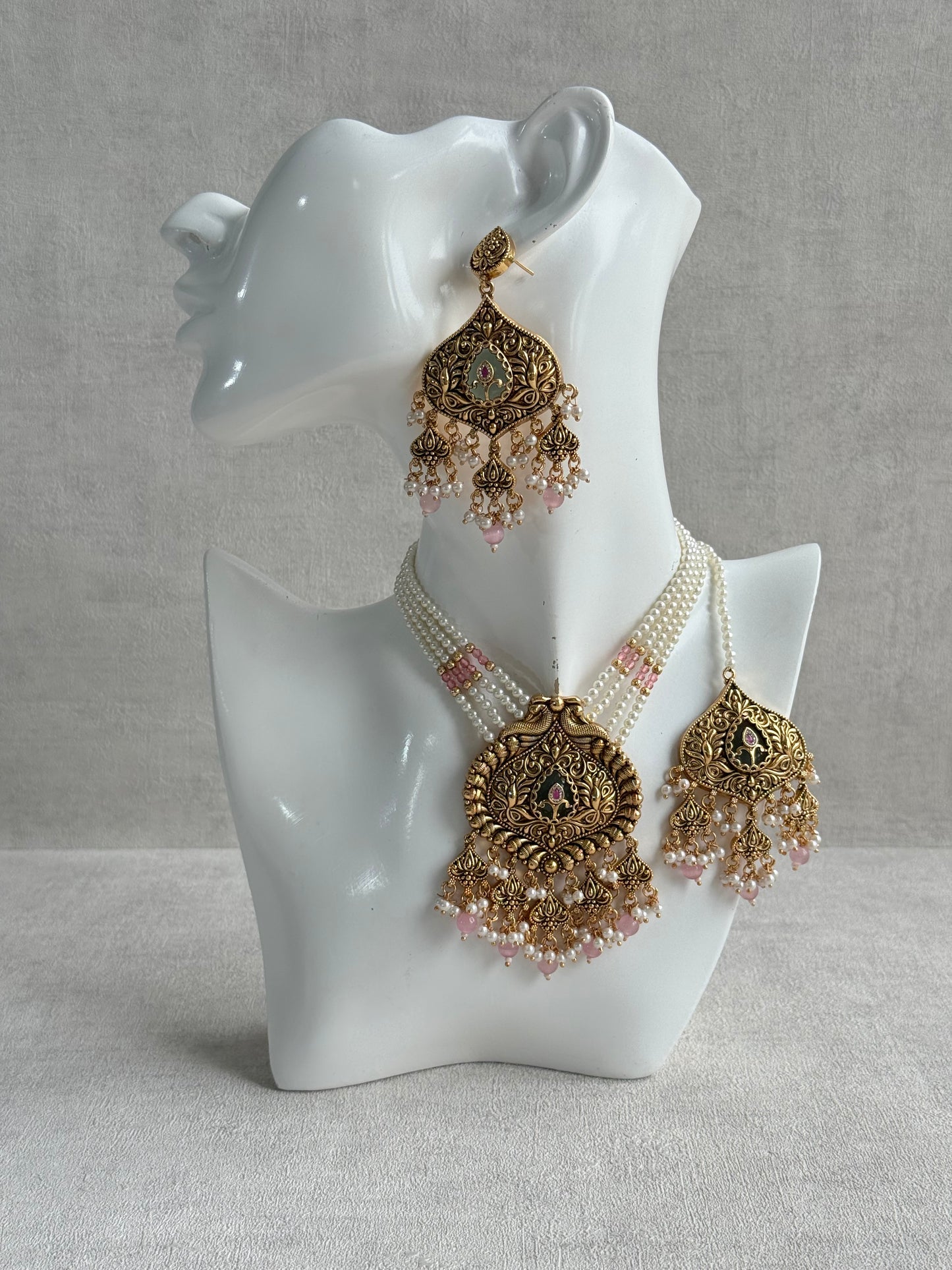 Ayura Designs Afia Necklace Set with Earrings & Tikka – Antique Gold, Blush Pink Pearls, Green Centre Stone & Peacock Motifs