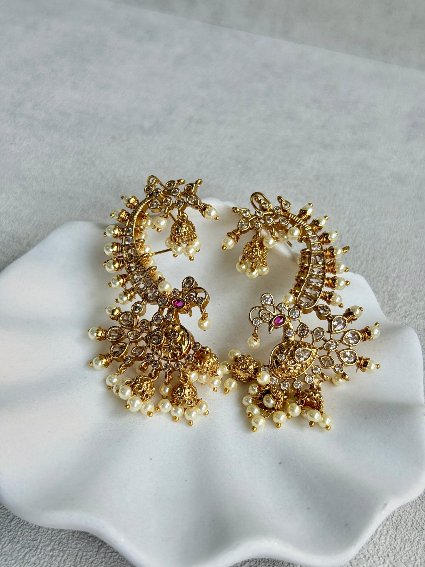 Ayura Designs Megha Half Ear Cuff Earrings – Gold Peacock Motif with Kundan Crystals, Pink Stone Accents & Pearl Jhumka Drops