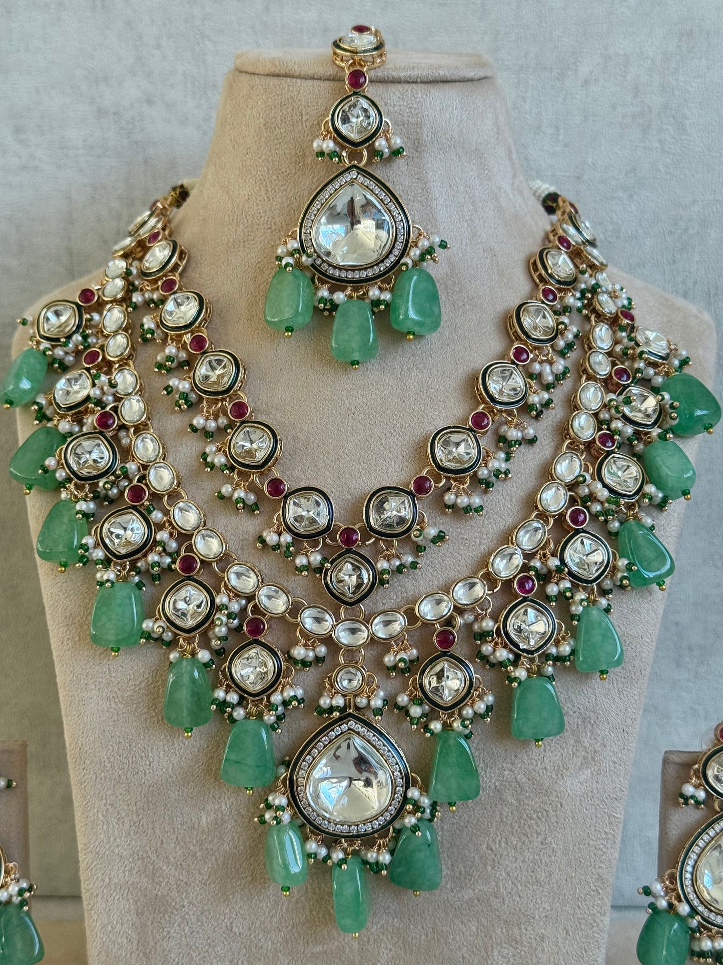 Ayura Designs Malika Bridal Set with Necklace, Jhumkis, Tikka, Nath, Ring & Sheeshphool – Jadau Kundan Craftsmanship with Mirror-Cut Polki, Jade-Toned Drops, Ruby Accents & Antique Gold Finish