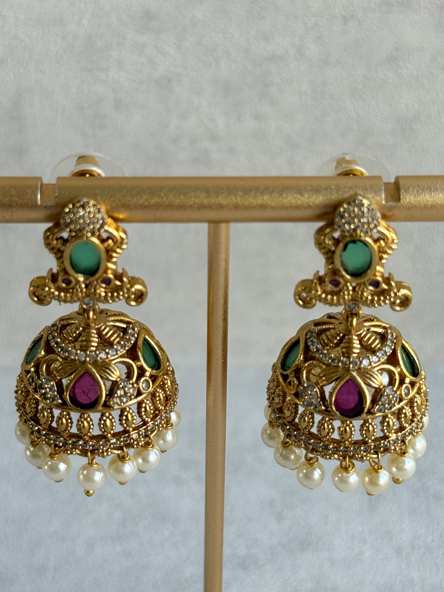 Ayura Designs Ehla Jhumkis – Gold Peacock Design with Green & Ruby Pink Stones, Crystals & Pearl Drops