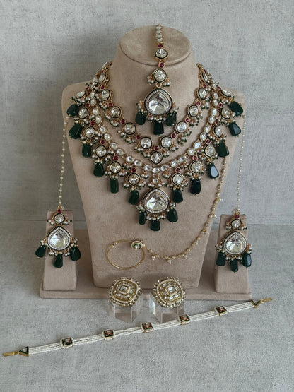 Ayura Designs Malika Bridal Set with Necklace, Jhumkis, Tikka, Nath, Ring & Sheeshphool – Jadau Kundan Craftsmanship with Mirror-Cut Polki, Emerald Green Drops, Ruby Accents & Antique Gold Finish