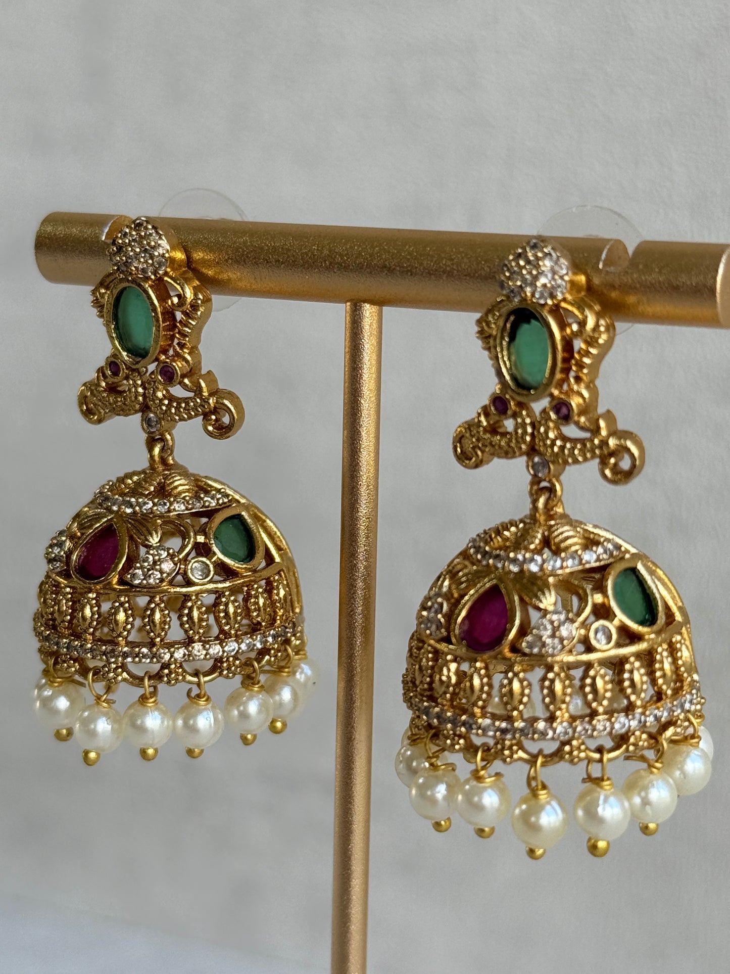 Ayura Designs Ehla Jhumkis – Gold Peacock Design with Green & Ruby Pink Stones, Crystals & Pearl Drops