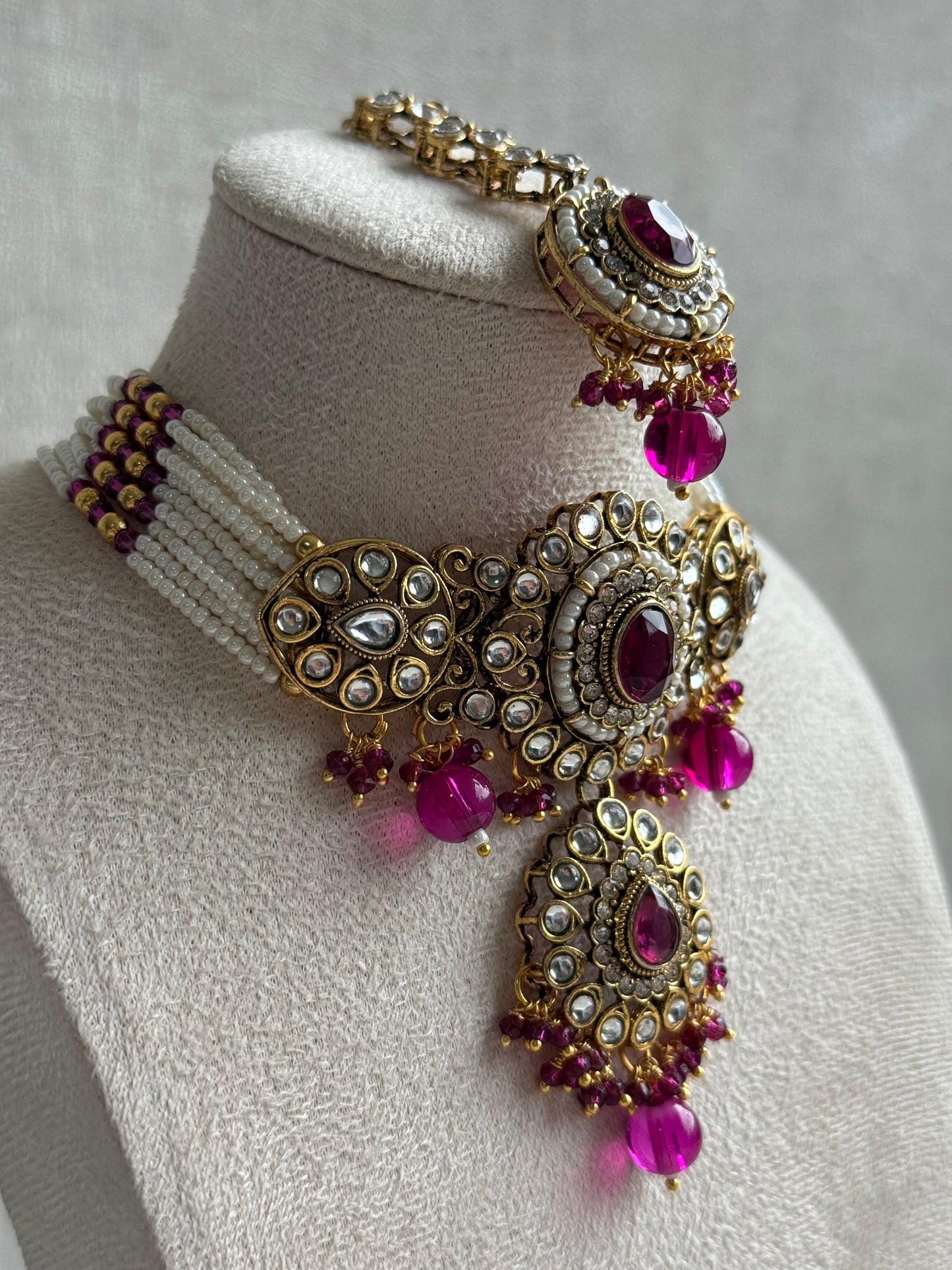 Ayura Designs Muskaan Set – Choker, Jhumkis & Tikka with Magenta Beads, Kundan Stones & Antique Gold Finish