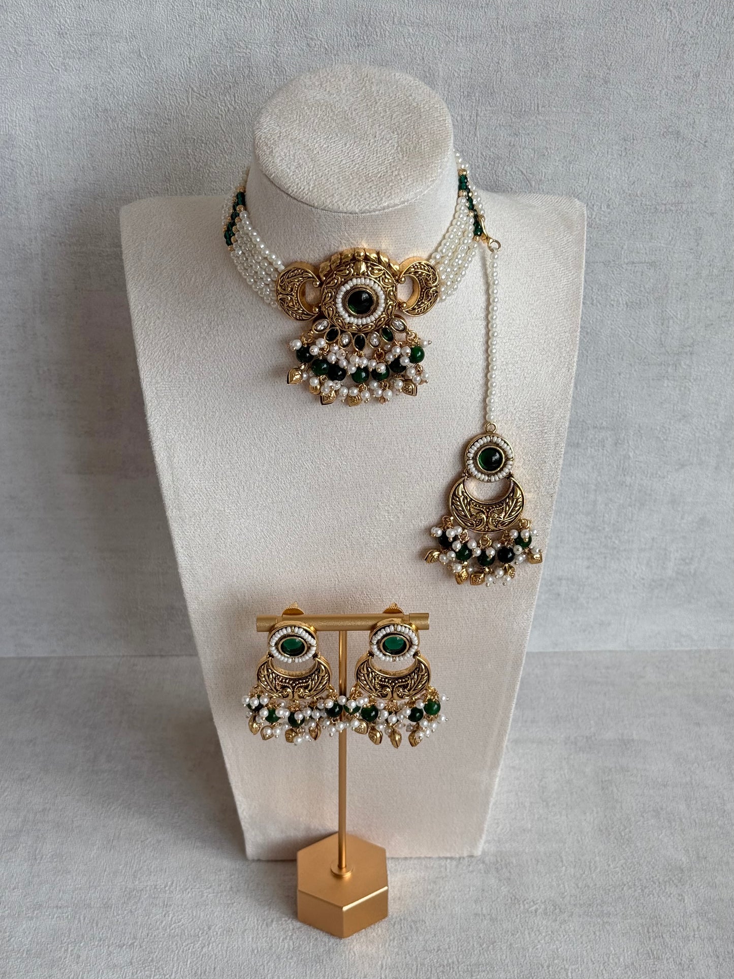 Ayura Designs Mehr Choker Set with Earrings & Tikka – Emerald Green Stones, Pearl Beads, Pearl Strands & Antique Gold Finish