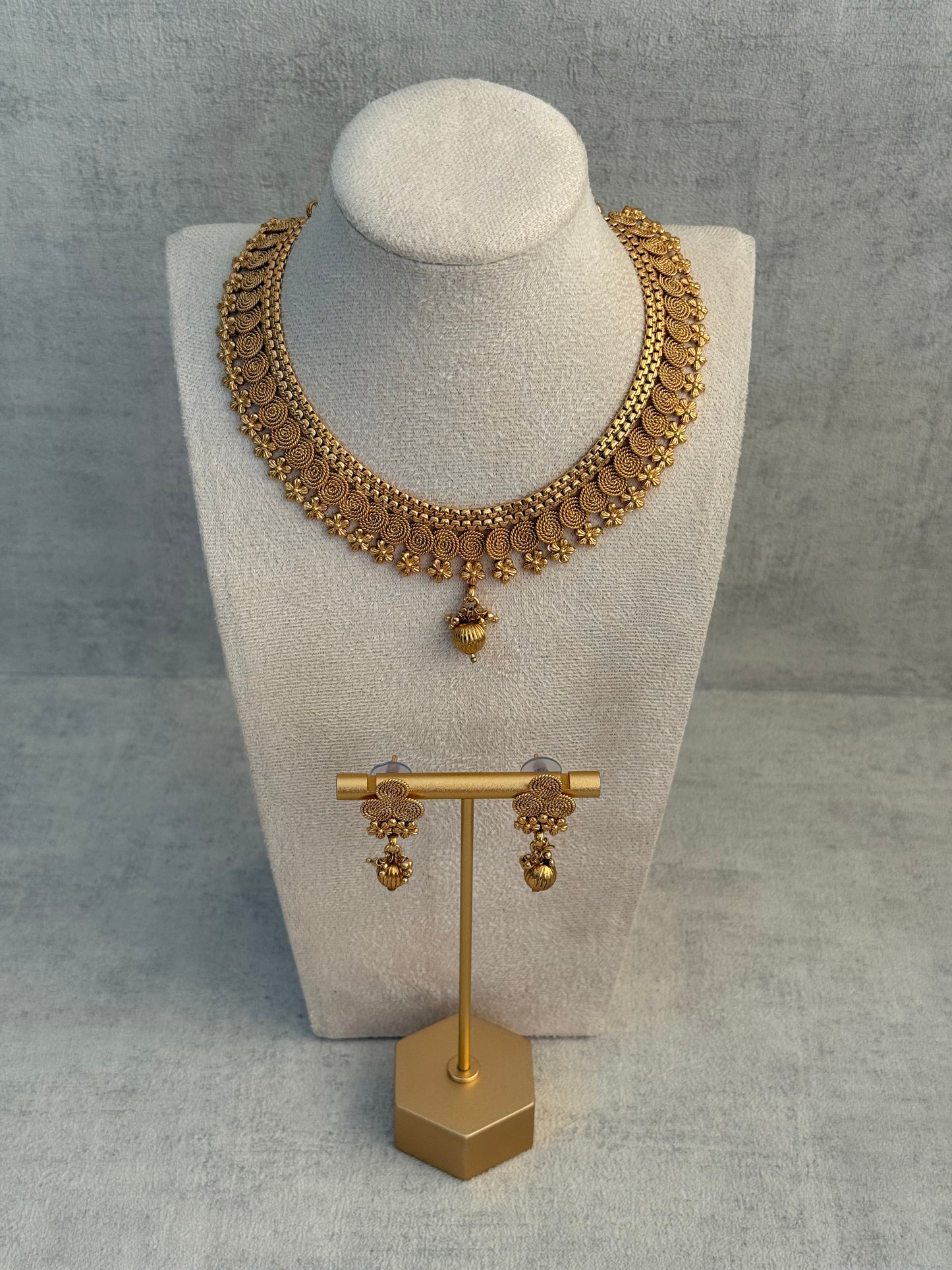 Ayura Designs Purna Set with Necklace & Earrings – Antique Gold Finish, Floral Motifs & Textured Pendant Detail