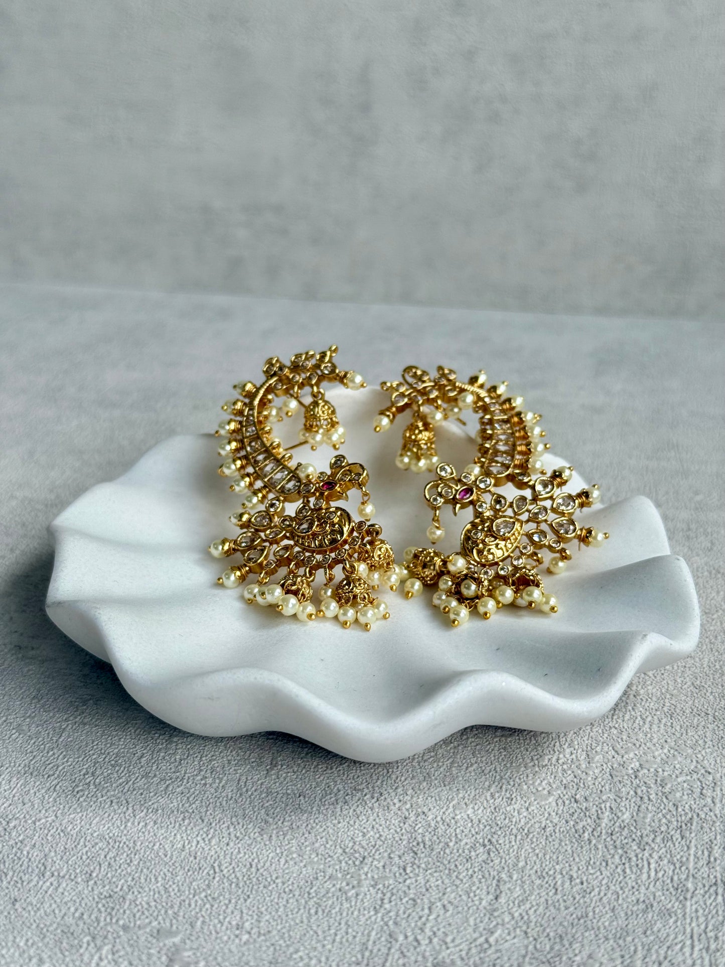 Ayura Designs Megha Half Ear Cuff Earrings – Gold Peacock Motif with Kundan Crystals, Pink Stone Accents & Pearl Jhumka Drops