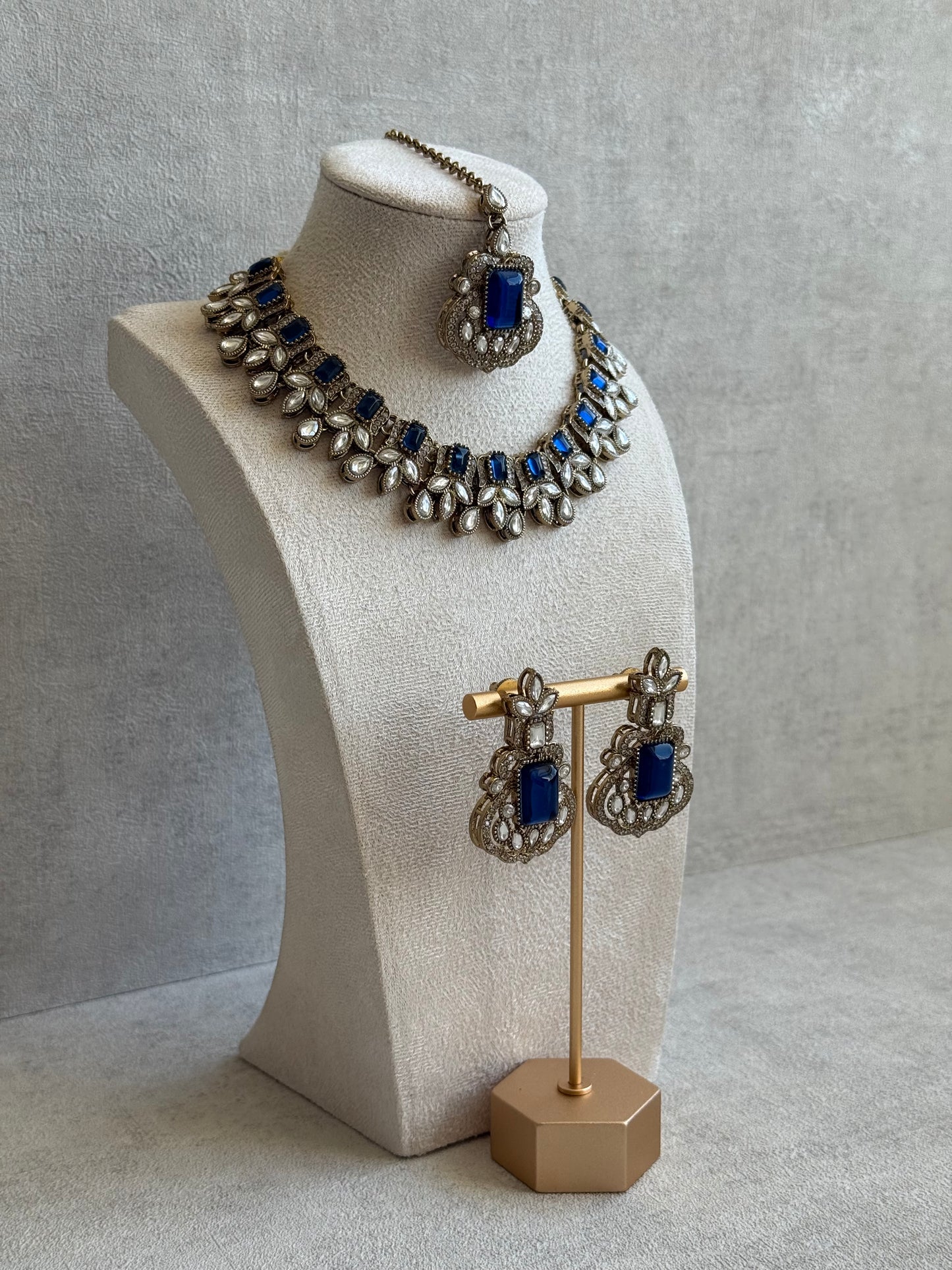 Ayura Designs Olivia Set with Necklace, Earrings & Tikka – Navy Blue Stones, Pear-Cut White Accents & Antique Gold Finish