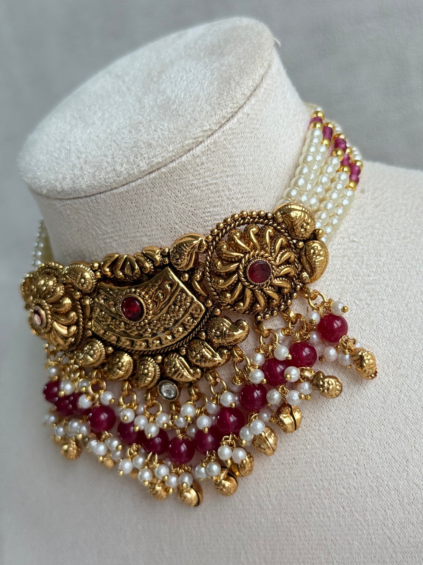 Ayura Designs Sairish Choker Set with Earrings & Tikka – Ruby Pink Beads, Pearl Detailing, Ghungroos, Paisley Motifs & Antique Gold Finish