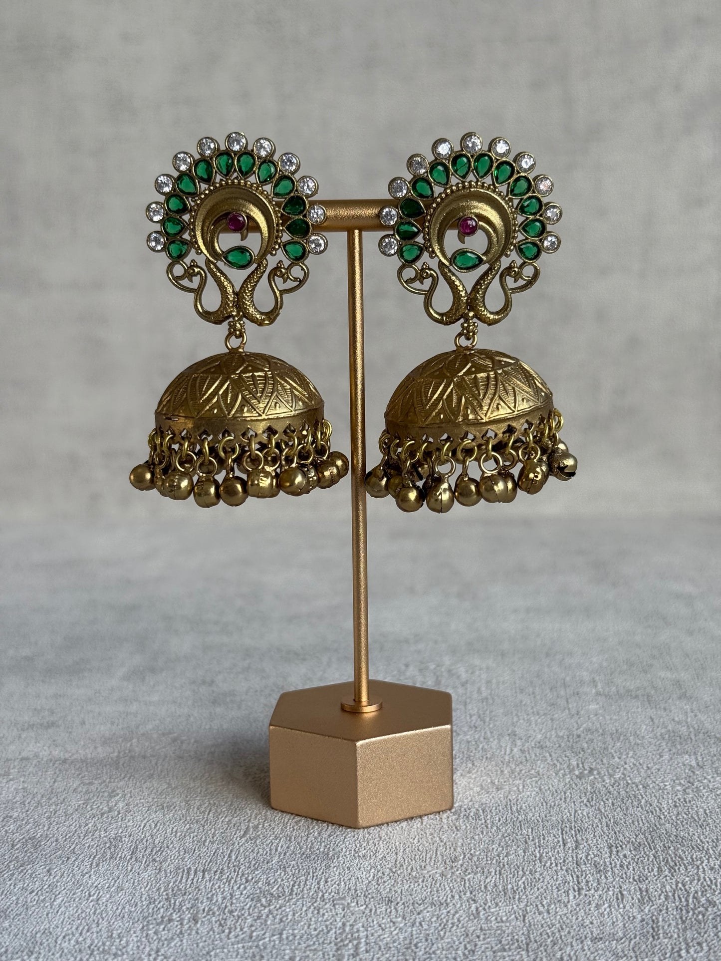 Ayura Designs Moraya Jhumkis – Emerald Green Peacock Motif with Antique Gold Detailing