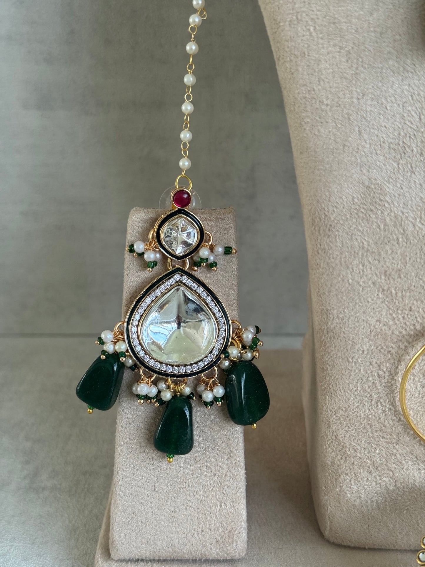 Ayura Designs Malika Bridal Set with Necklace, Jhumkis, Tikka, Nath, Ring & Sheeshphool – Jadau Kundan Craftsmanship with Mirror-Cut Polki, Emerald Green Drops, Ruby Accents & Antique Gold Finish