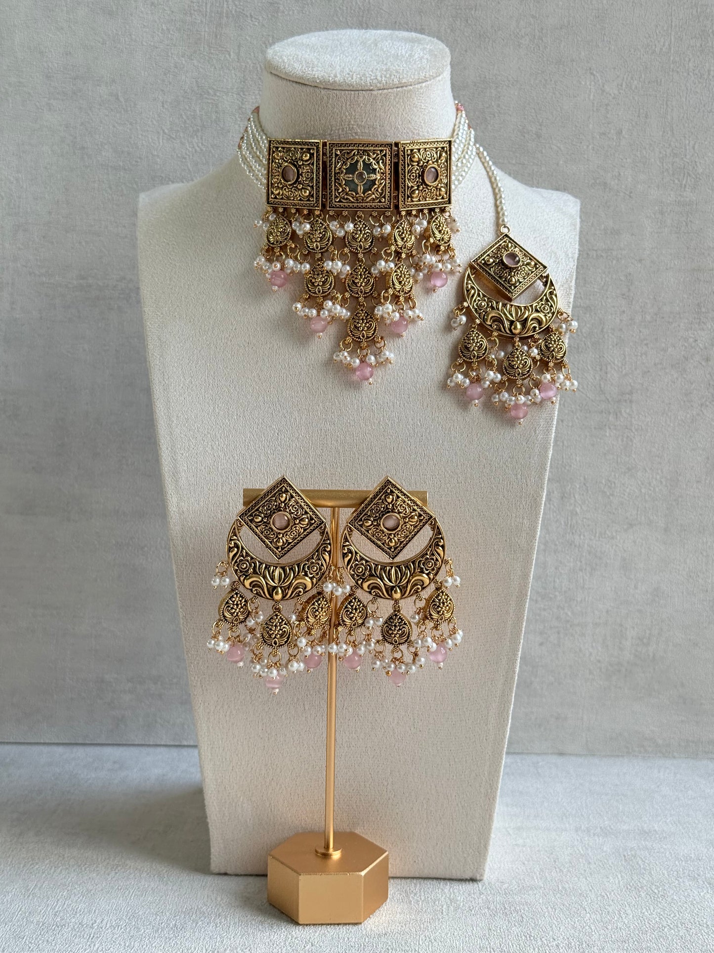 Ayura Designs Samera Choker Set with Earrings & Tikka – Blush Pink Beads, Pearl Detailing, Green Centre Stone, Floral Motifs & Antique Gold Finish