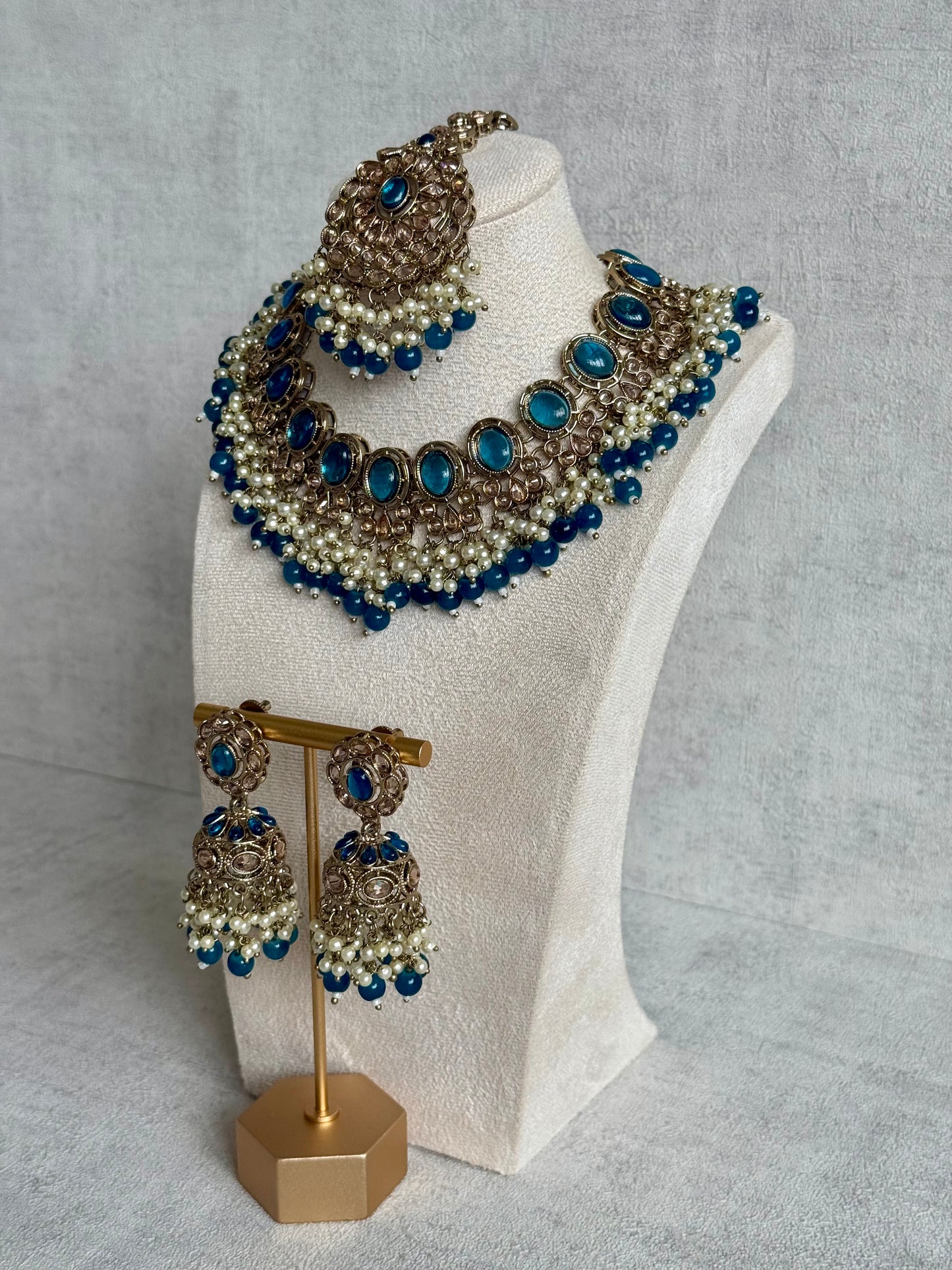 Ayura Designs Zubi Set with Jhumkis & Tikka – Deep Blue Stones, Pearl Detailing & Antique Gold Finish