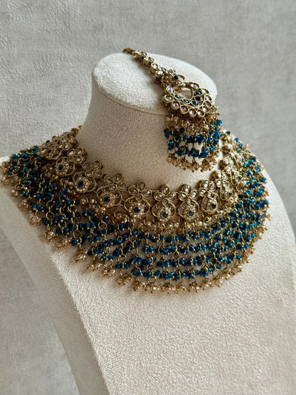 Ayura Designs Mahreen Set – Necklace, Jhumkis & Tikka with Mirror-Cut Stones, Peacock Blue Beads & Gold Finish