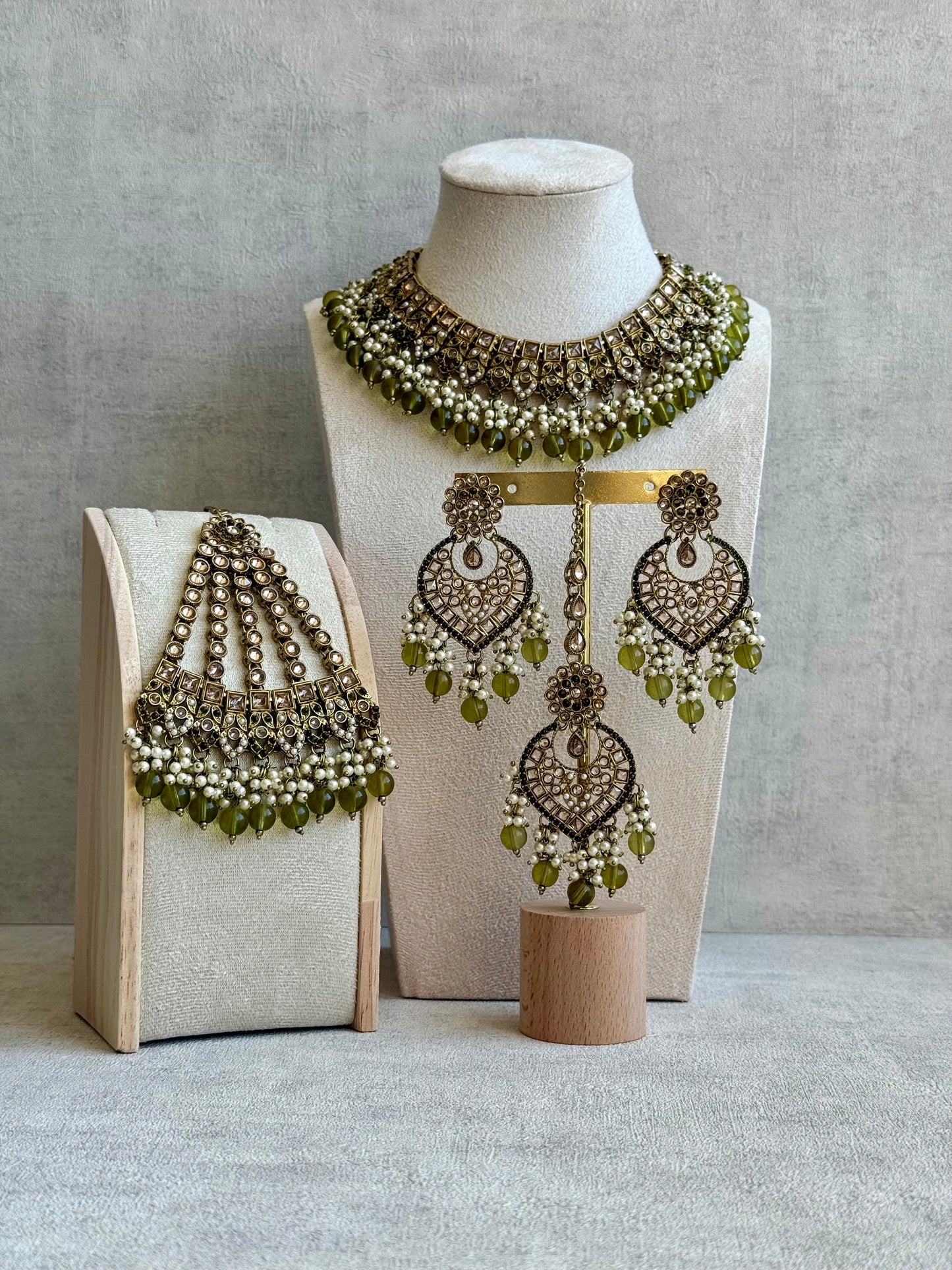 Ayura Designs Sabeen Set with Choker, Jhumkis, Tikka & Jhoomar – Champagne Kundan, Pearl Clusters & Olive Green Beads
