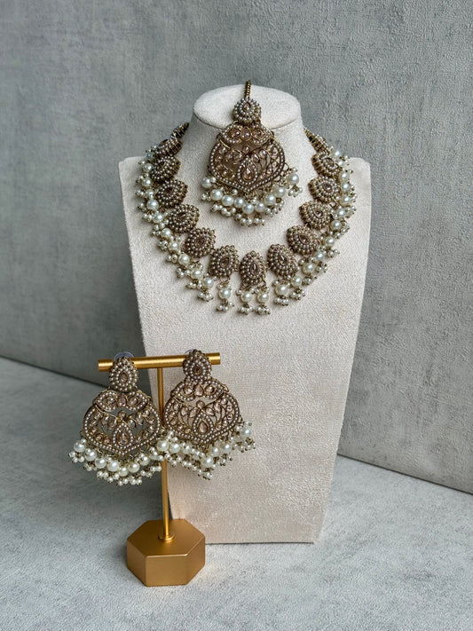 Ayura Designs Zarina Set Earrings & Tikka: Exquisite Gold-Tone Adornments with Polki Stones & White Pearls