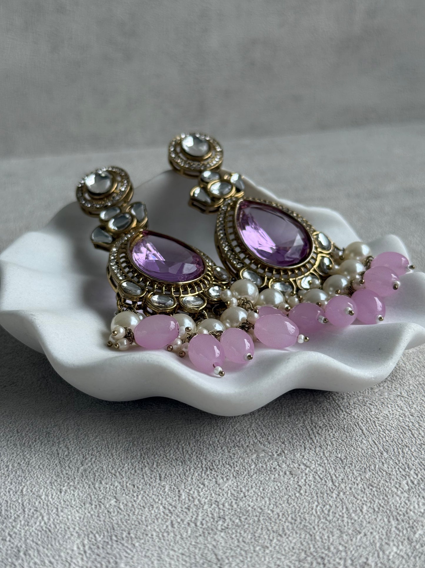 Ayura Designs Nageen Earrings – Antique Gold Jhumkis with Lilac Stones, Mirror-Cut Accents & Pearl Drops