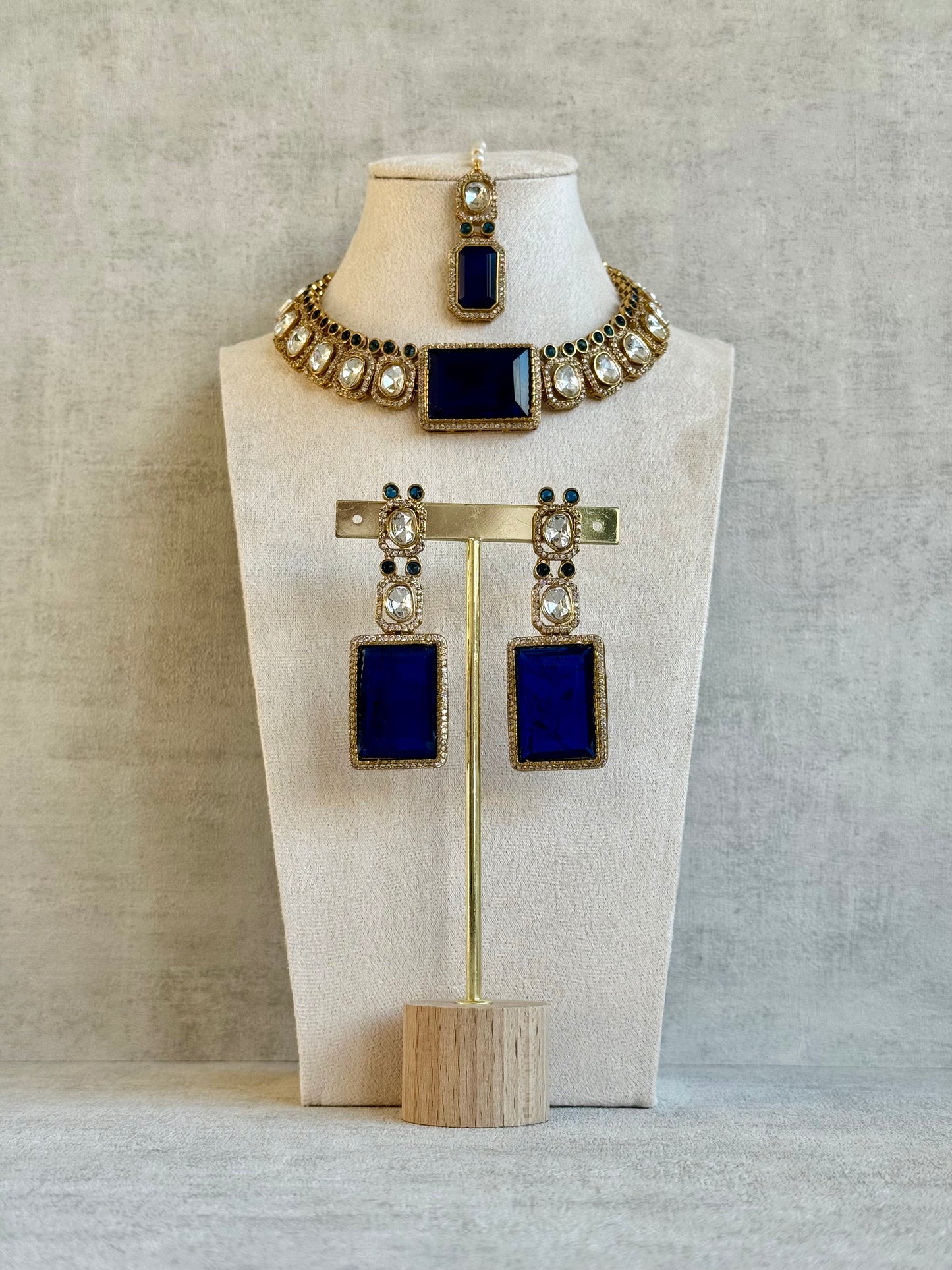 Ayura Designs Clara Set with Earrings & Tikka  – Royal Blue Stones with Moissanite and Antique Gold Finish