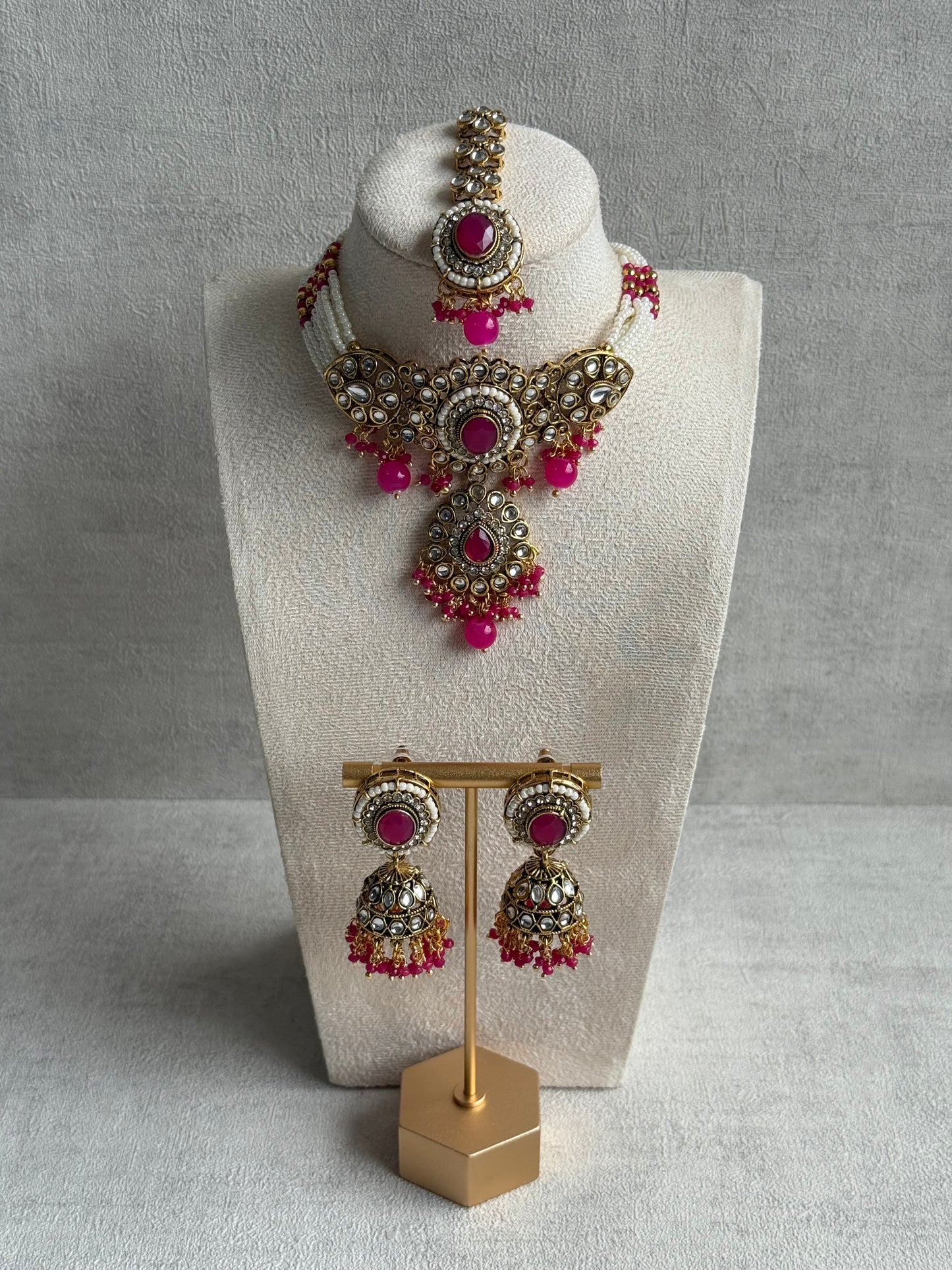 Ayura Designs Muskaan Set – Choker, Jhumkis & Tikka with Hot Pink Beads, Kundan Stones & Antique Gold Finish