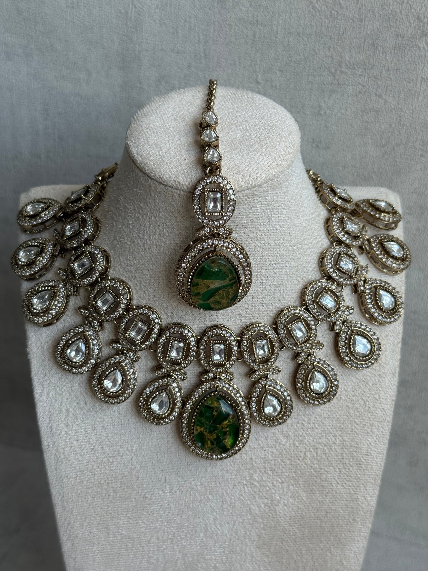 Ayura Designs Aurora Set with Earrings & Tikka – Emerald Green Stone & Mirror-Cut Accents in Antique Gold Finish