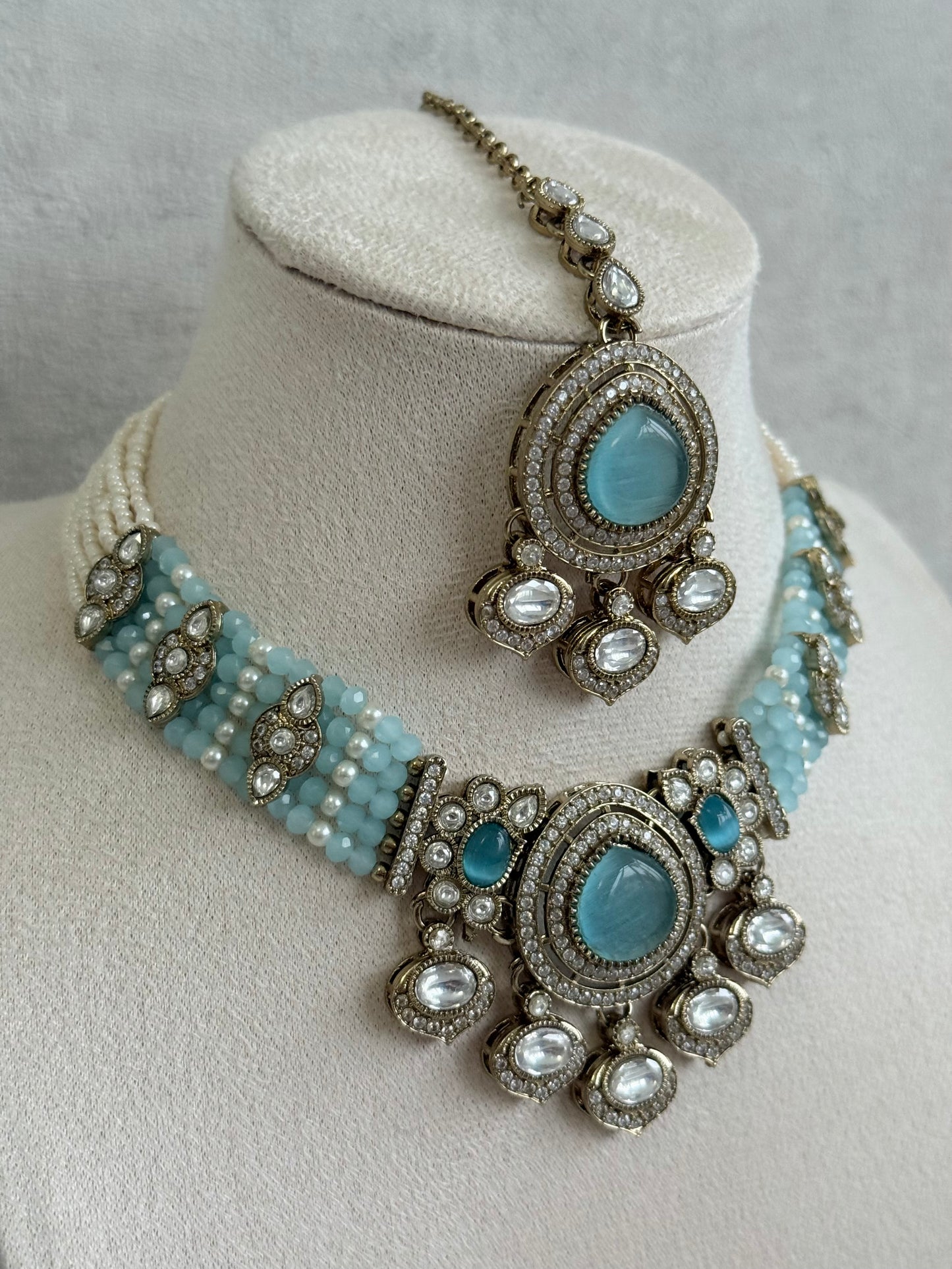 Ayura Designs Rahi Necklace Set with Earrings & Tikka – Aqua Blue Stones with Mirror-Cut Detailing & Pearl Strands
