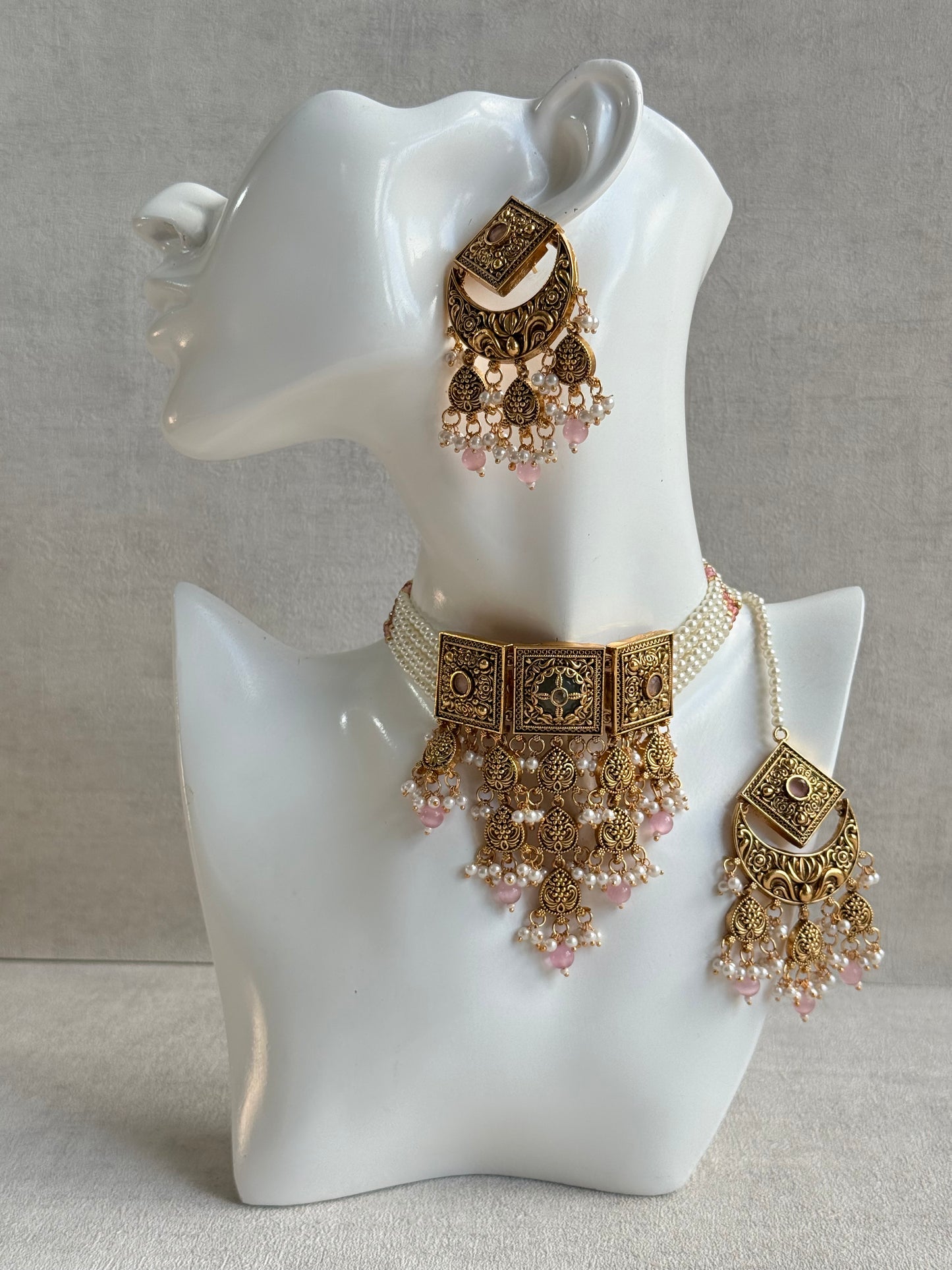 Ayura Designs Samera Choker Set with Earrings & Tikka – Blush Pink Beads, Pearl Detailing, Green Centre Stone, Floral Motifs & Antique Gold Finish