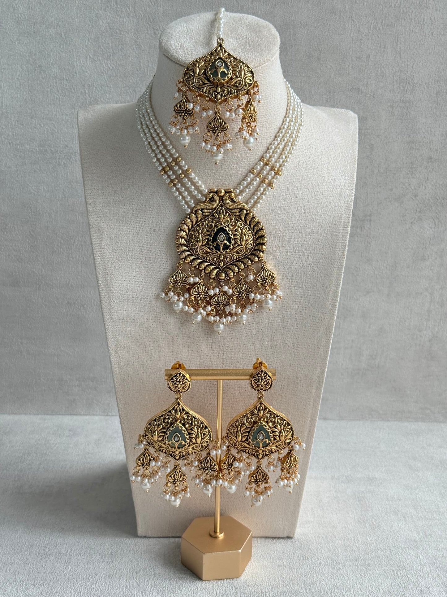Ayura Designs Afia Necklace Set with Earrings & Tikka – Antique Gold, Ivory Pearls, Green Centre Stone & Peacock Motifs