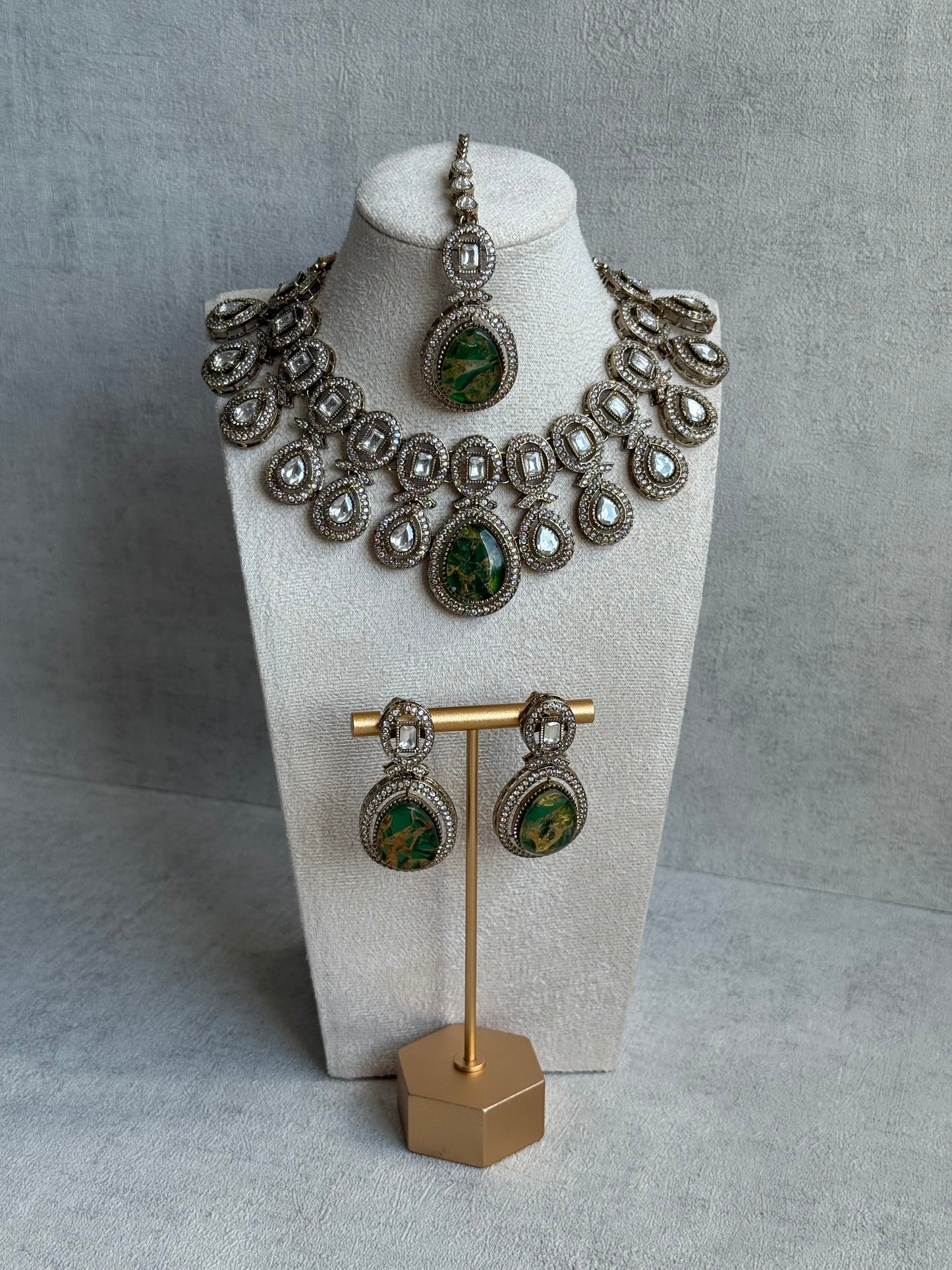 Ayura Designs Aurora Set with Earrings & Tikka – Emerald Green Stone & Mirror-Cut Accents in Antique Gold Finish