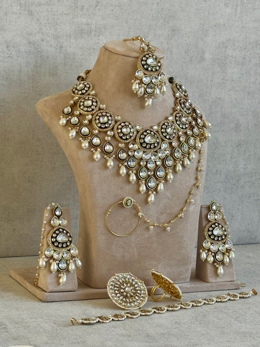 Ayura Designs Sultana Bridal Set with Necklace, Jhumkis, Tikka, Nath, Ring & Sheeshphool – Jadau Kundan Craftsmanship with Mirror-Cut Polki Stones, Ivory Pearls & Antique Gold Finish