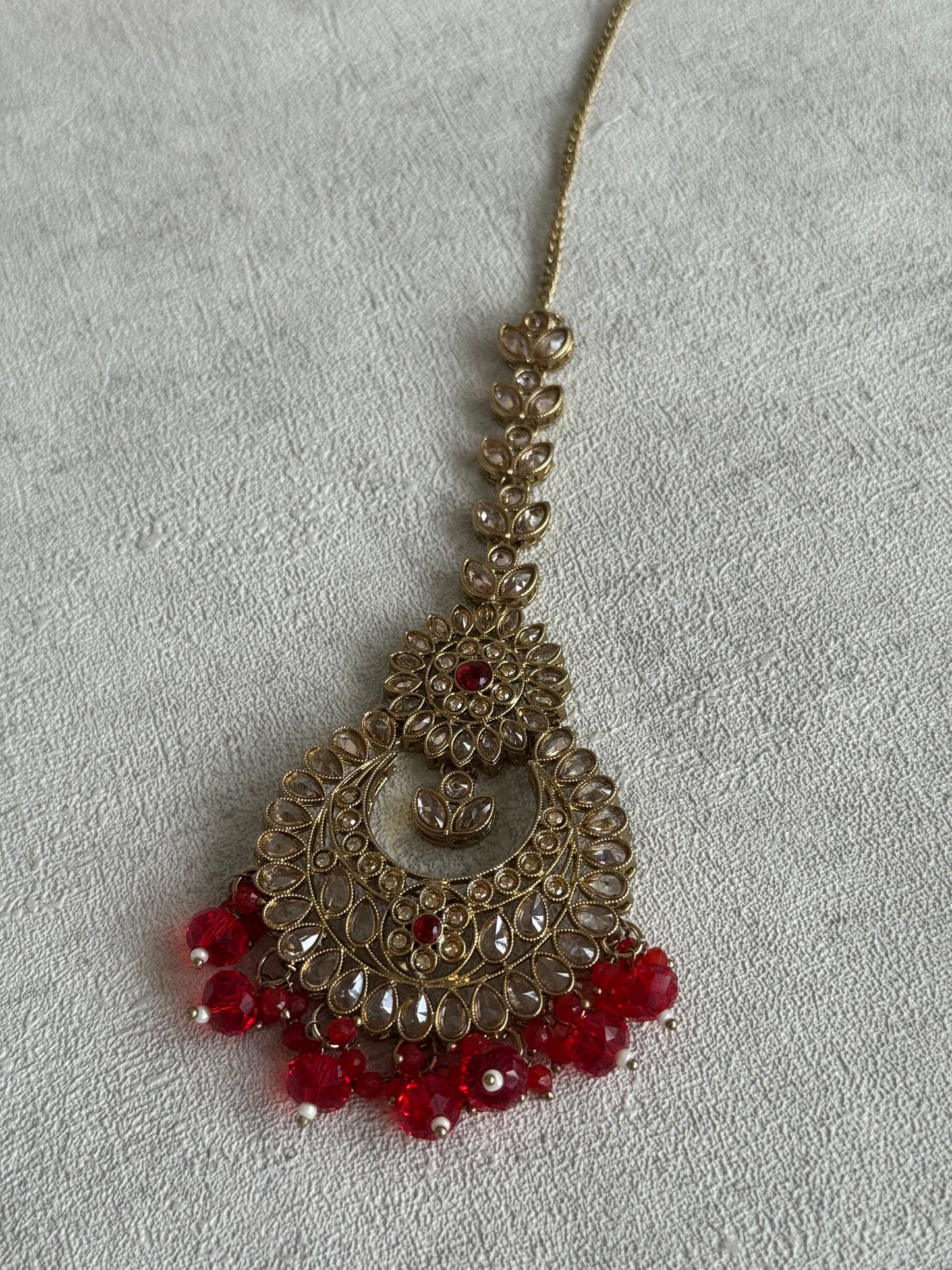 Ayura Designs Samreen Set with Tikka & Jhumkis – in Antique Gold with Red Beads & Mirror-Cut Stones