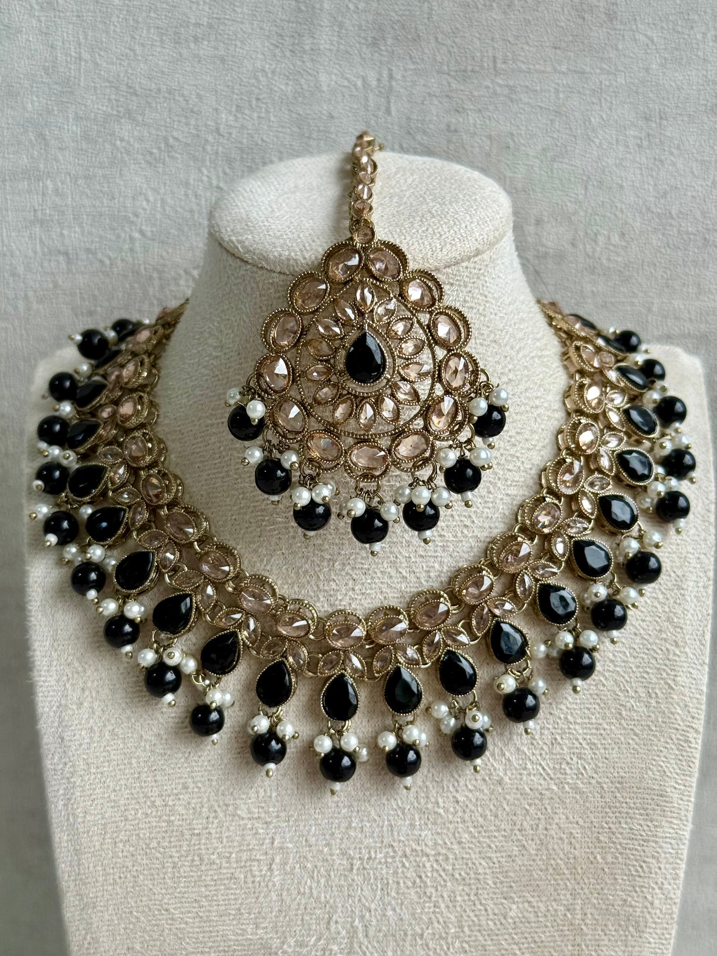 Ayura Designs Emaan Set with Jhumkis & Tikka – Black Beads, Mirror-Cut Stones & Antique Gold Finish