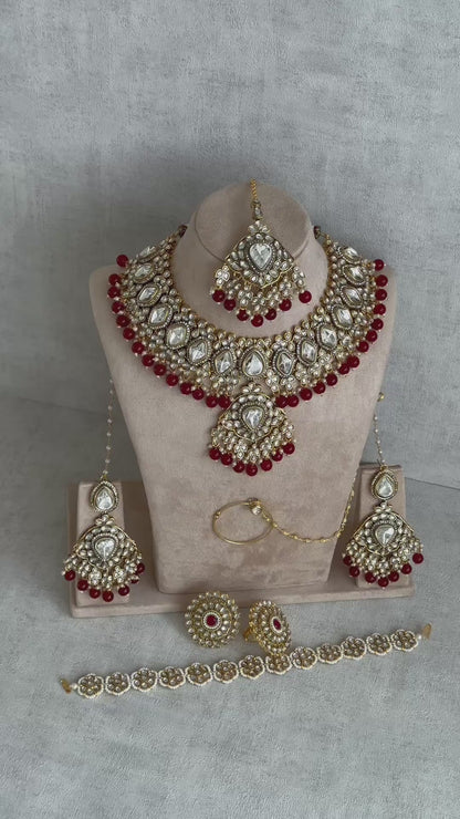 Ayura Designs Gulbahar Bridal Set with Necklace, Jhumkis, Tikka, Nath, Ring & Sheeshphool – Jadau Kundan Craftsmanship with Mirror-Cut Polki, Red Beads & Antique Gold Finish